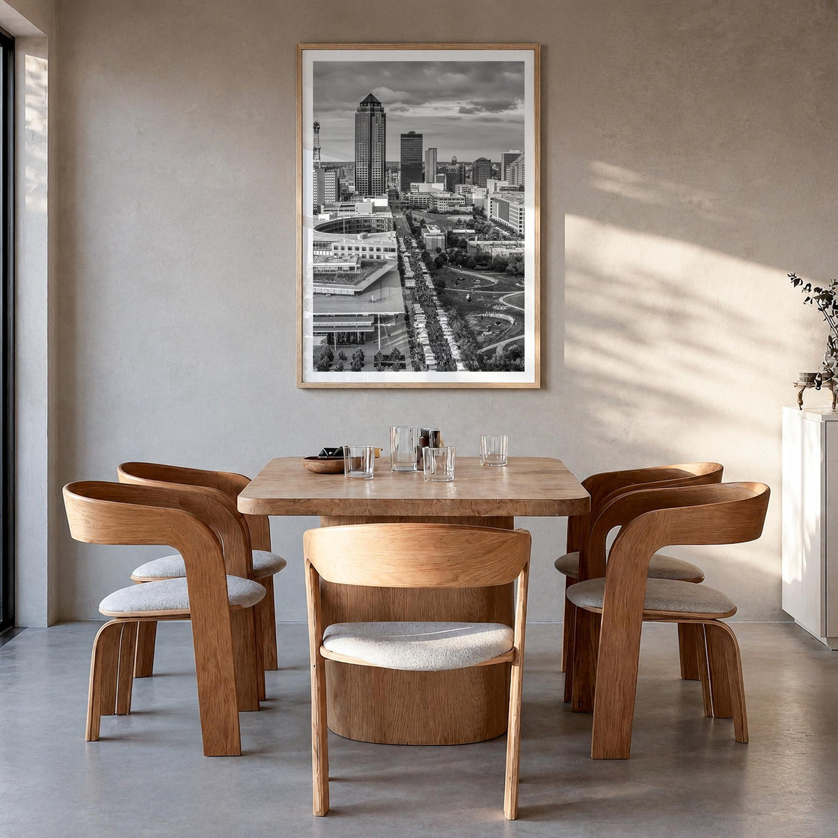 Des Moines black & white photo poster of Iowa, USA – vertical wall art in natural wood frame with white border, hanging on wa
