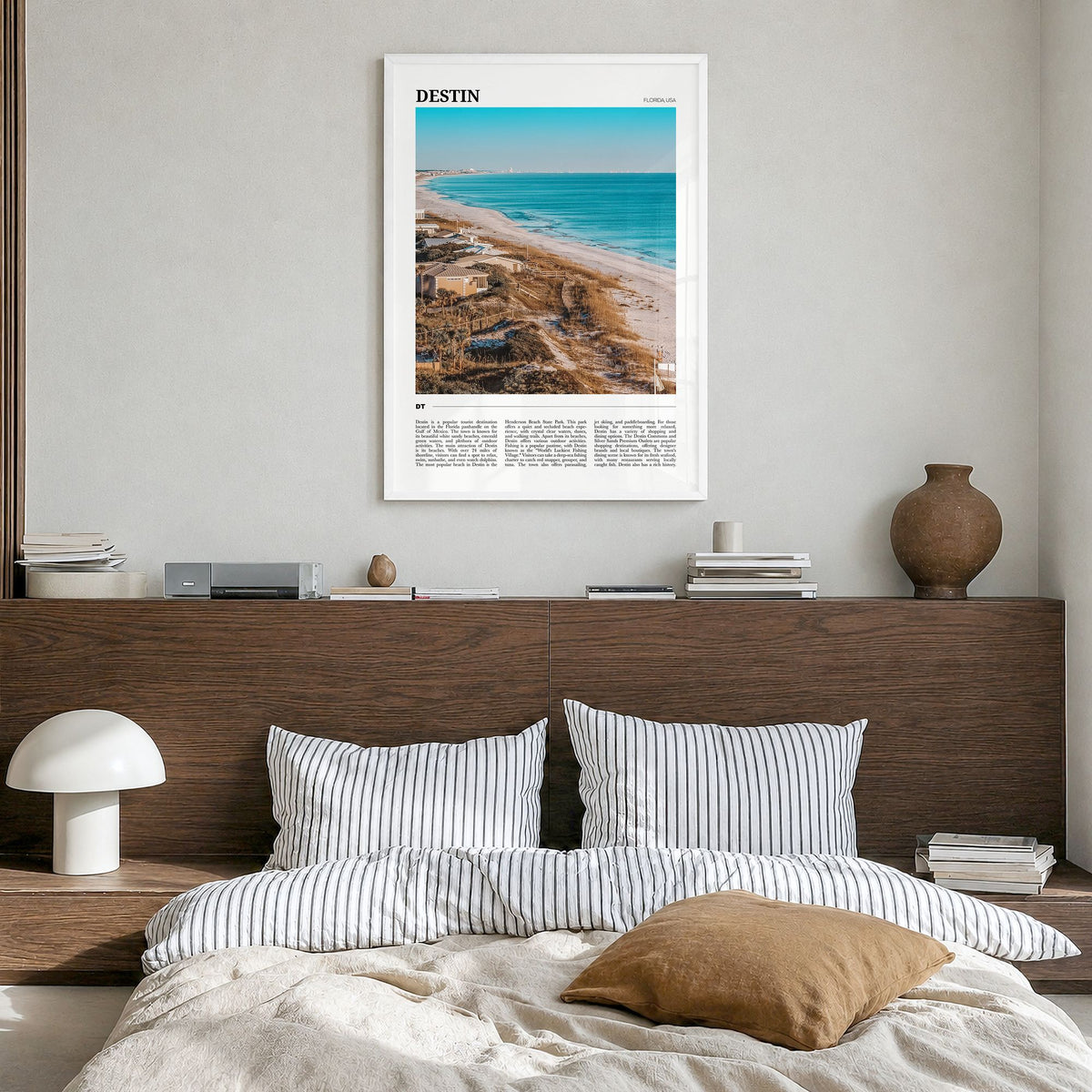 Destin Travel Poster in a white wood frame, hanging in a bedroom