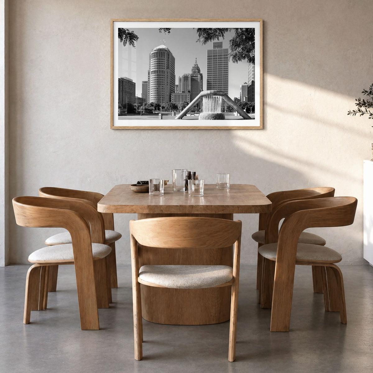 Detroit Photo Poster in a natural wood frame, hanging in a dining room, white border