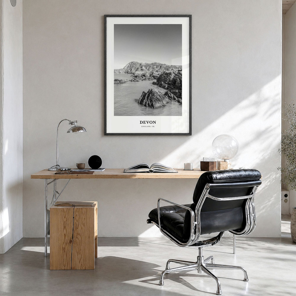 Devon Classic Poster in a black wood frame, hanging in a bright home office