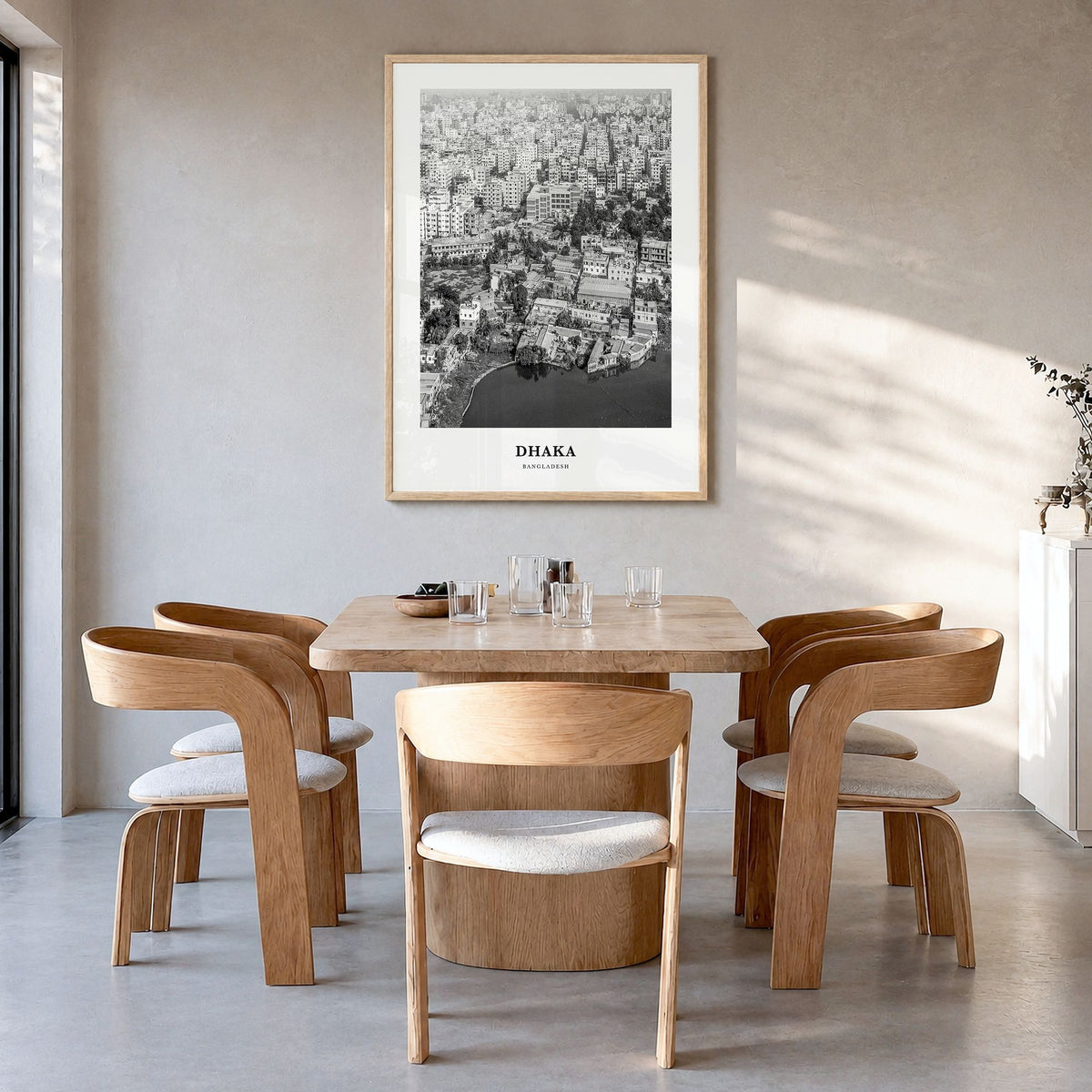 Dhaka Classic Poster in a natural wood frame, hanging in a dining room