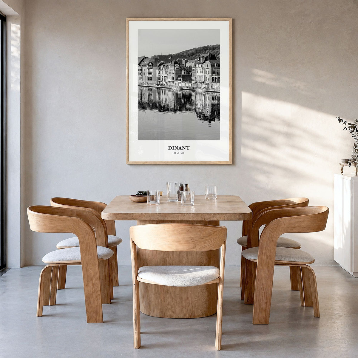 Dinant Classic Poster in a natural wood frame, hanging in a dining room