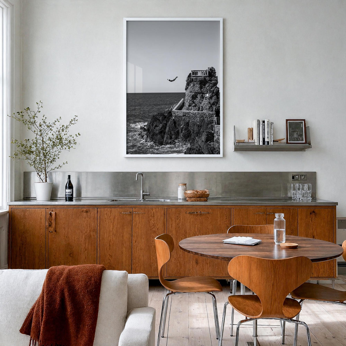 Diving black & white photo poster – vertical wall art in white wood frame, hanging on wall