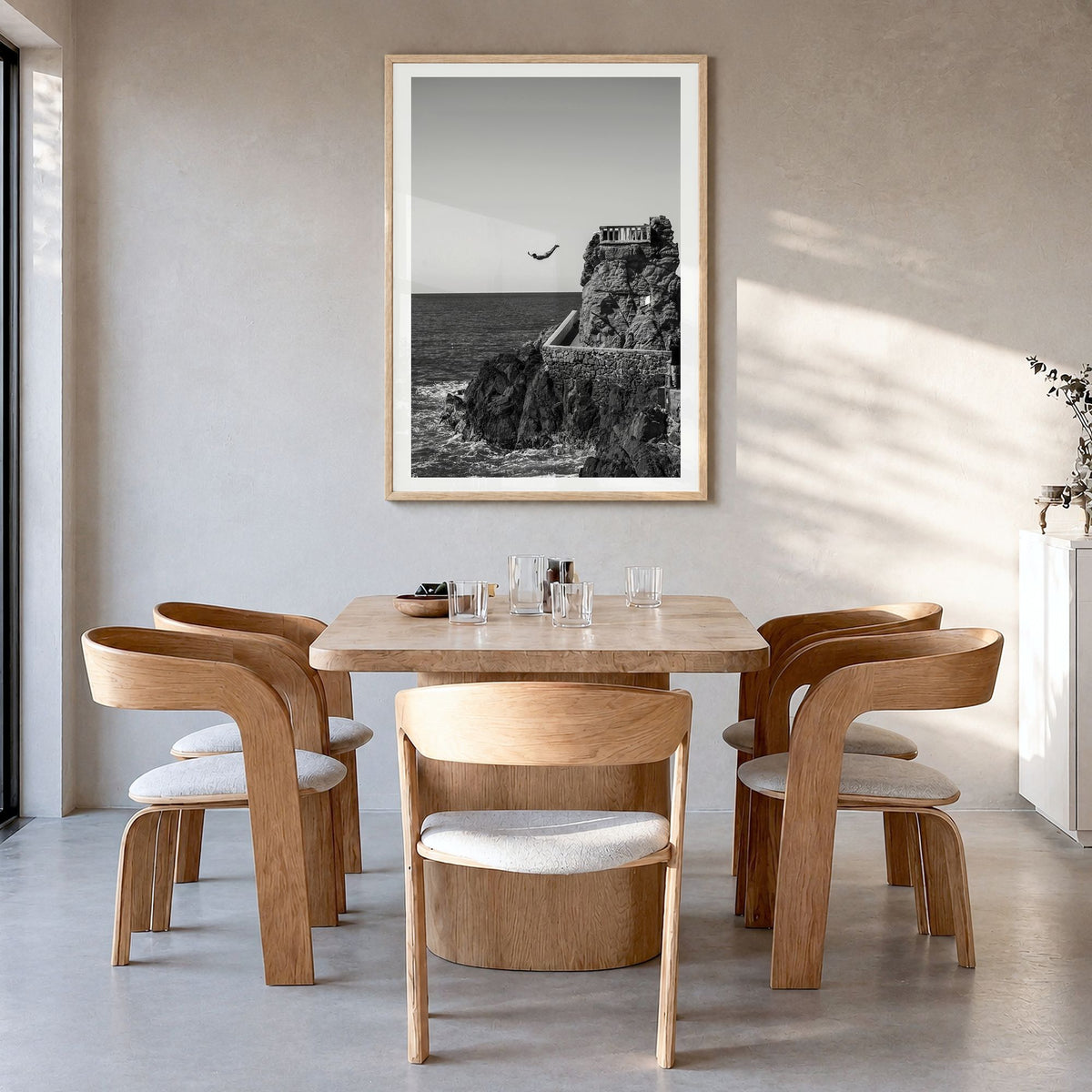 Diving Photo Poster in a natural wood frame, hanging in a dining room, white border