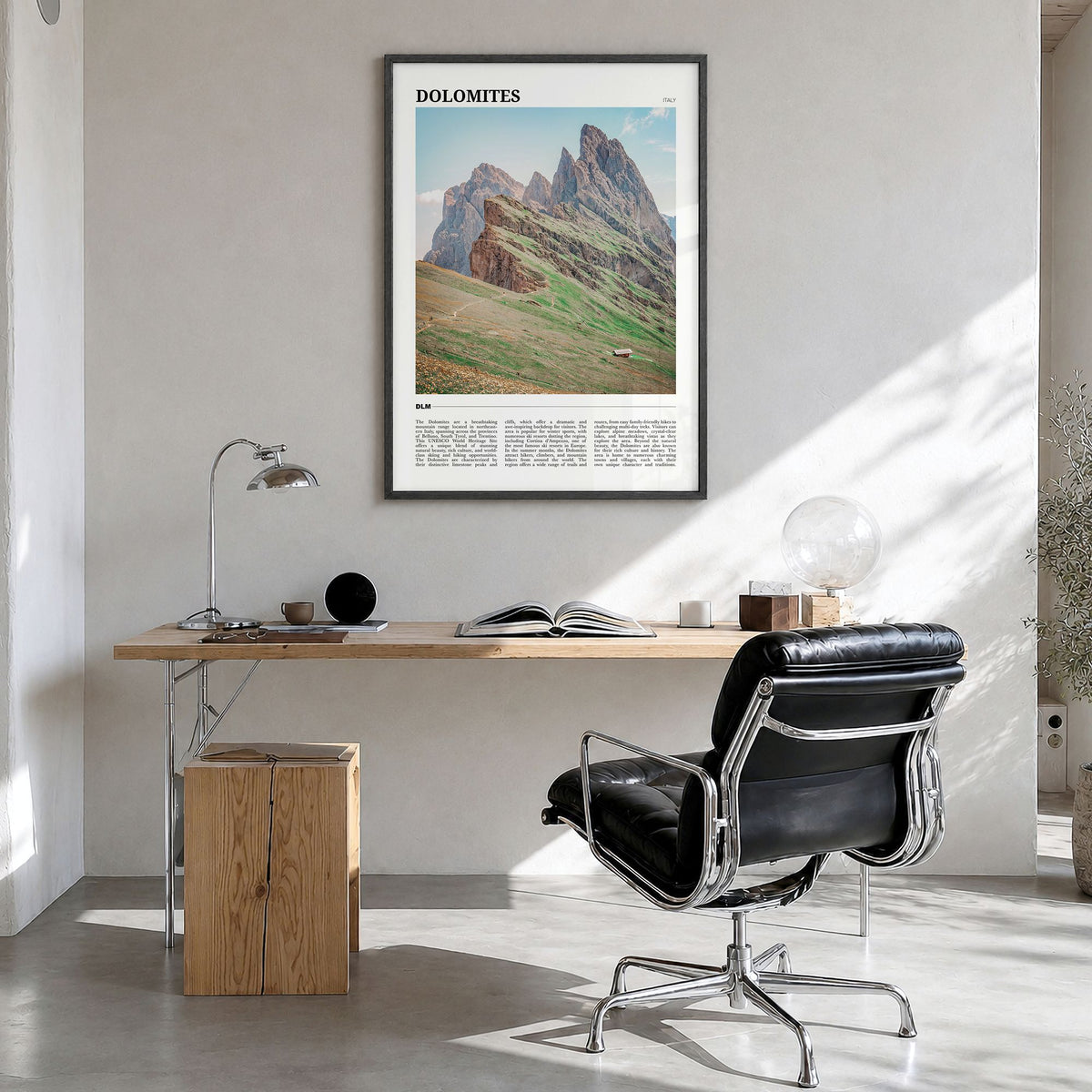 Dolomites Travel Poster in a black wood frame, hanging in a bright home office