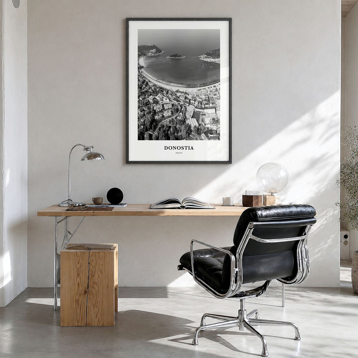 Donostia Classic Poster in a black wood frame, hanging in a bright home office