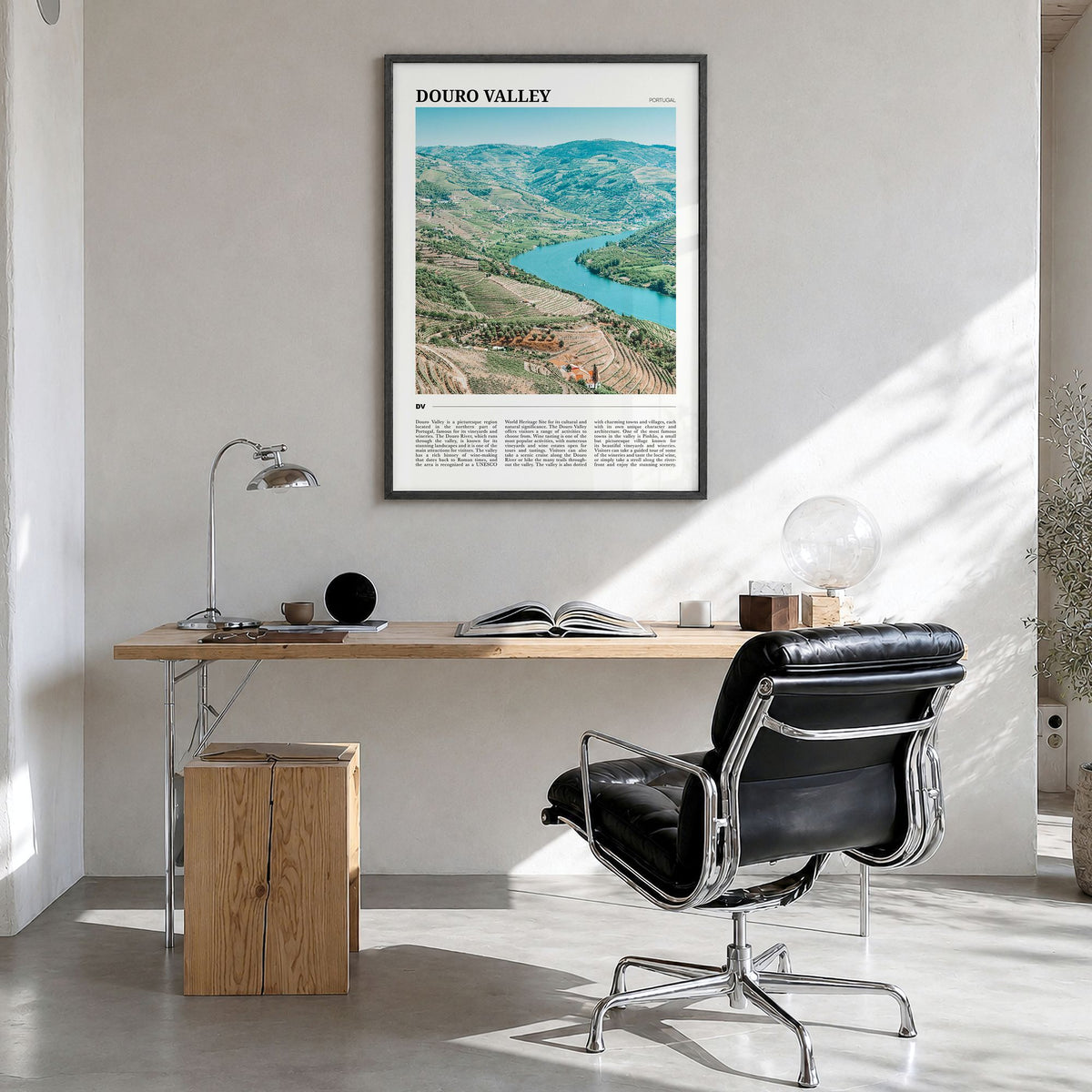 Douro Valley Travel Poster in a black wood frame, hanging in a bright home office