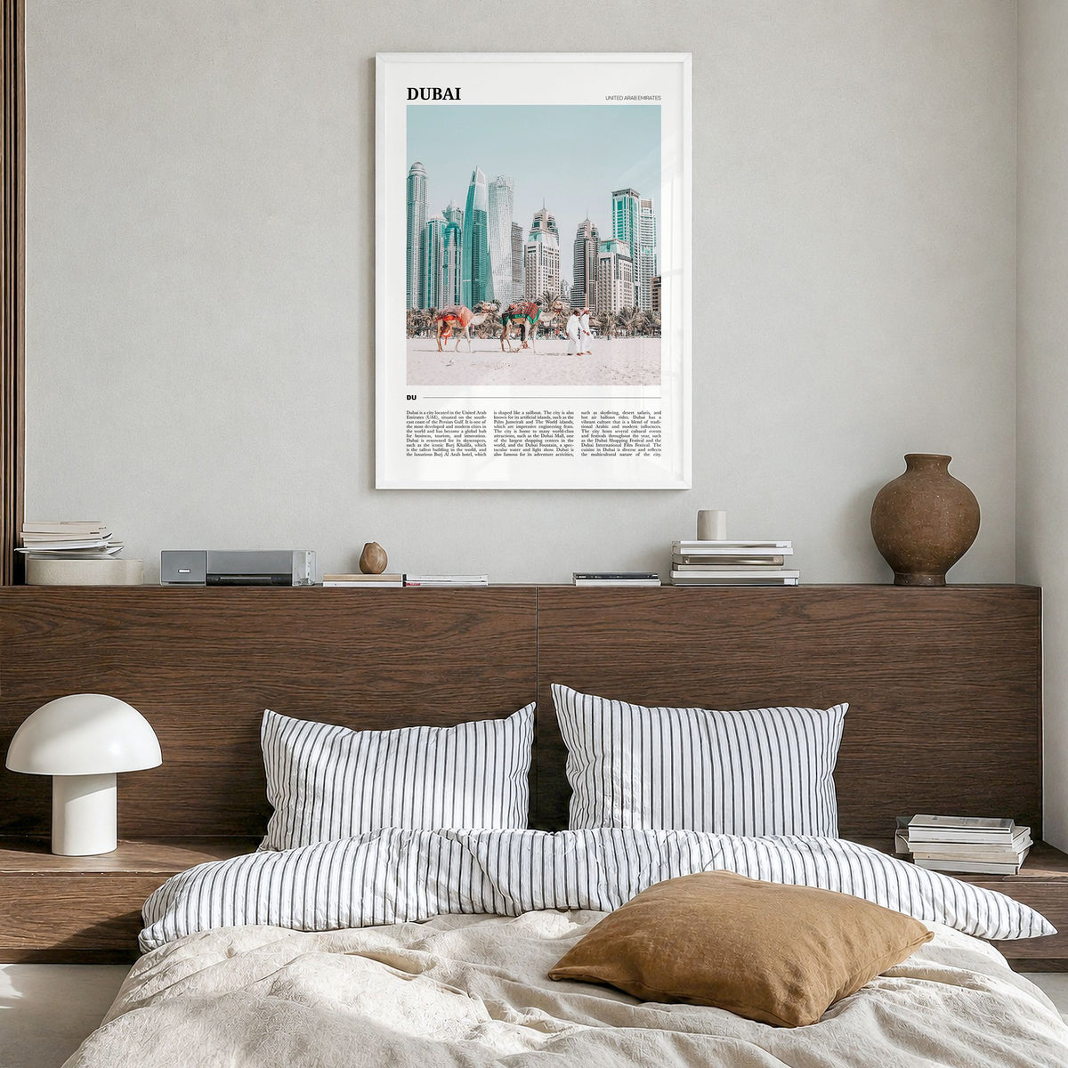 Dubai Travel Poster in a white wood frame, hanging in a bedroom