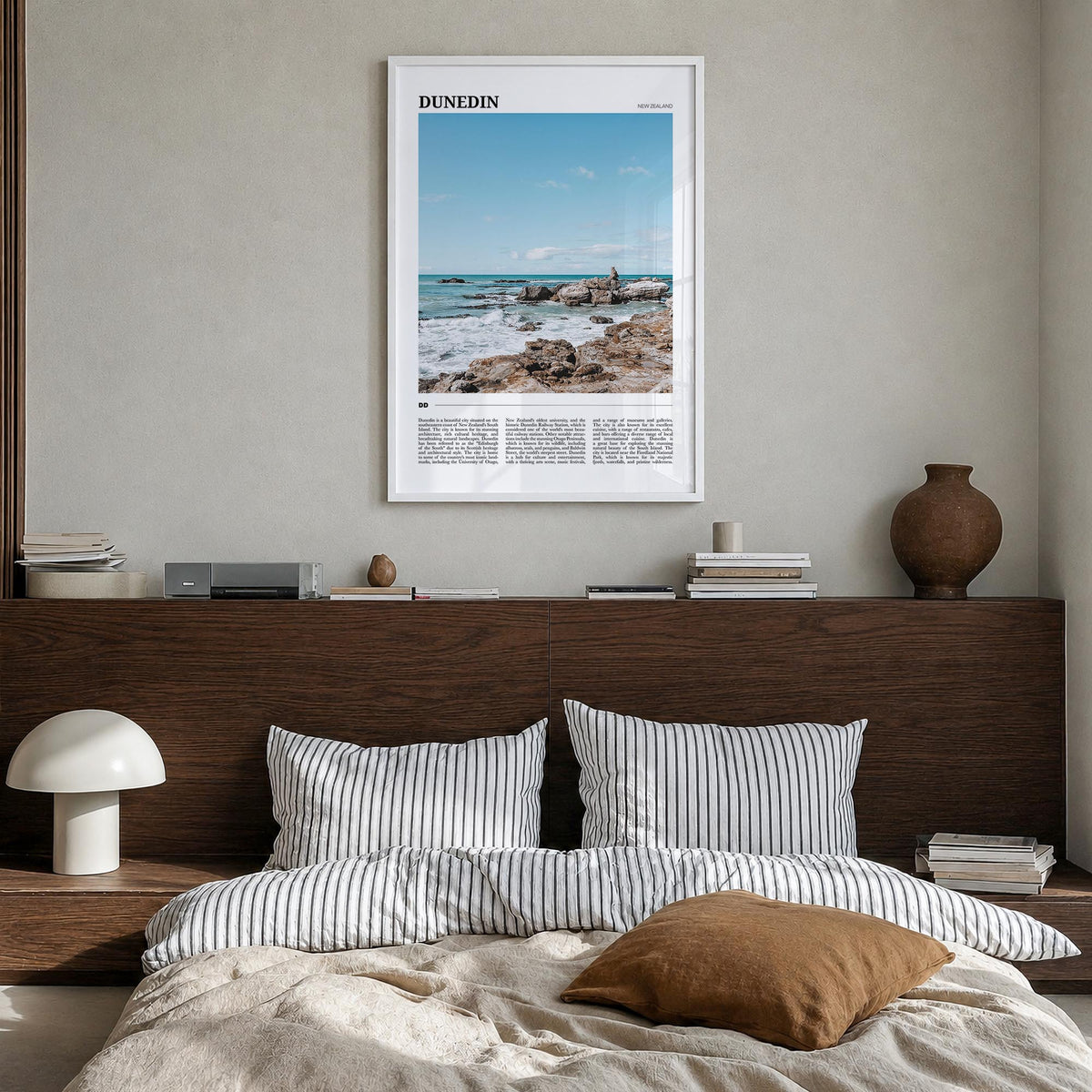 Dunedin no. 2 colorful travel poster of New Zealand – vertical wall art in white wood frame, hanging on wall