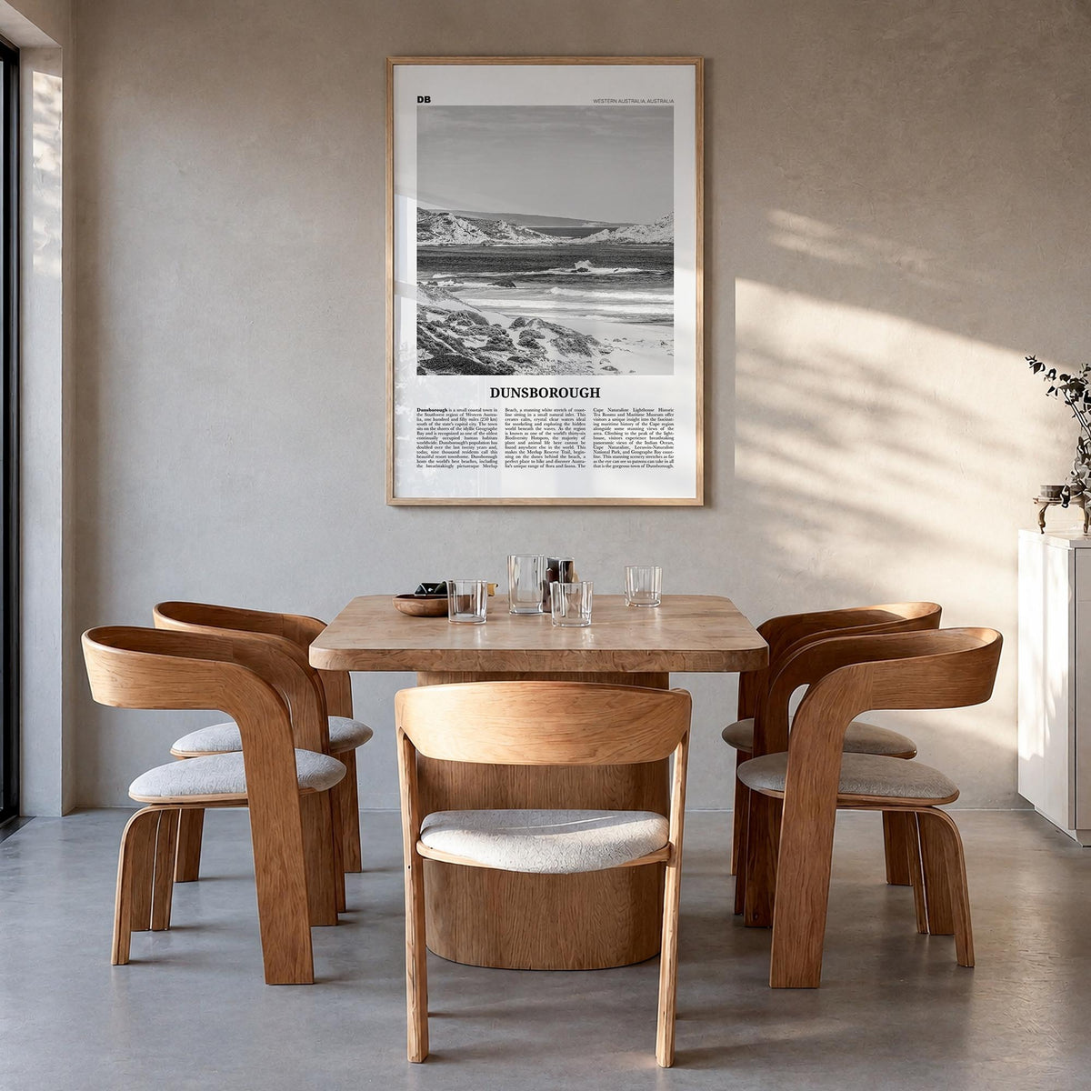 Dunsborough black & white newspaper poster of Australia – vertical wall art in natural wood frame, hanging on wall