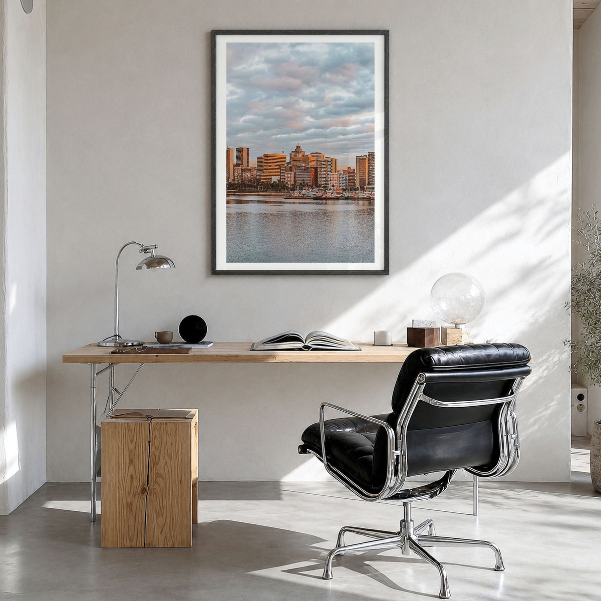 Durban Photo Poster in a black wood frame, hanging in a bright home office, white border