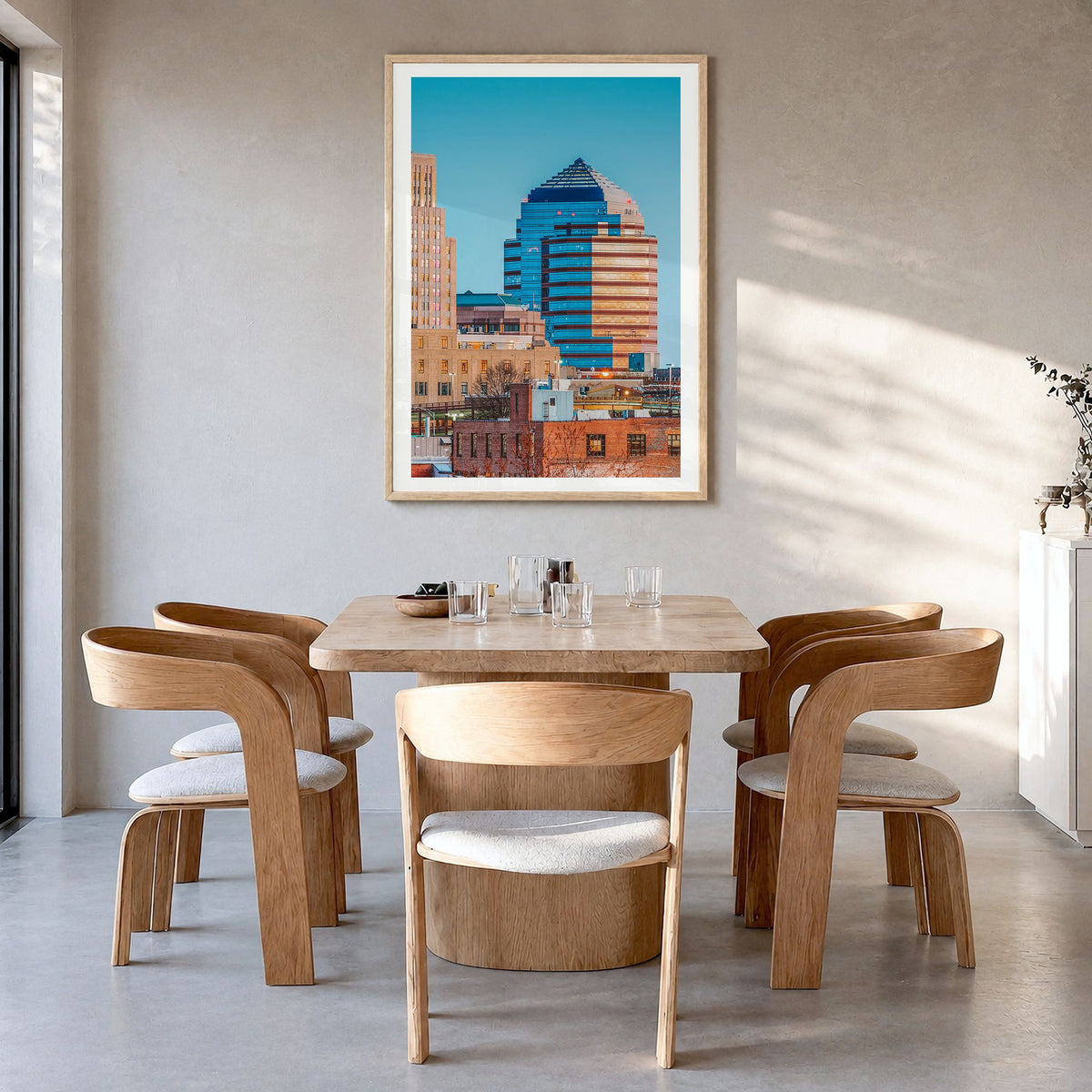 Durham, North Carolina Photo Poster in a natural wood frame, hanging in a dining room, white border
