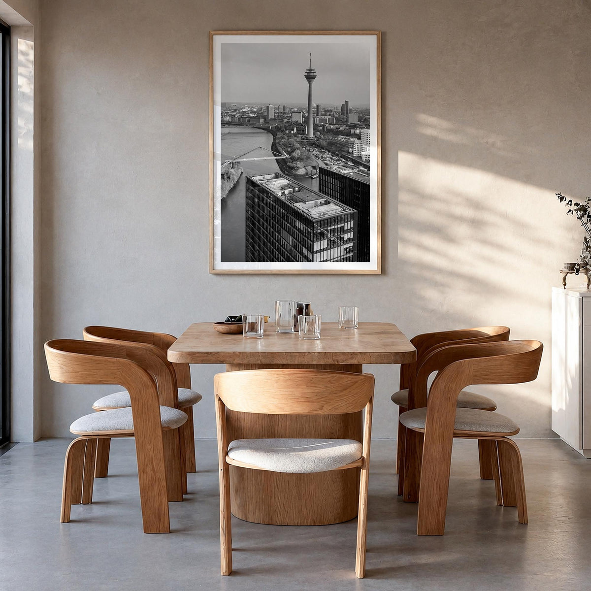 Düsseldorf black & white photo poster of Germany – vertical wall art in natural wood frame with white border, hanging on wall