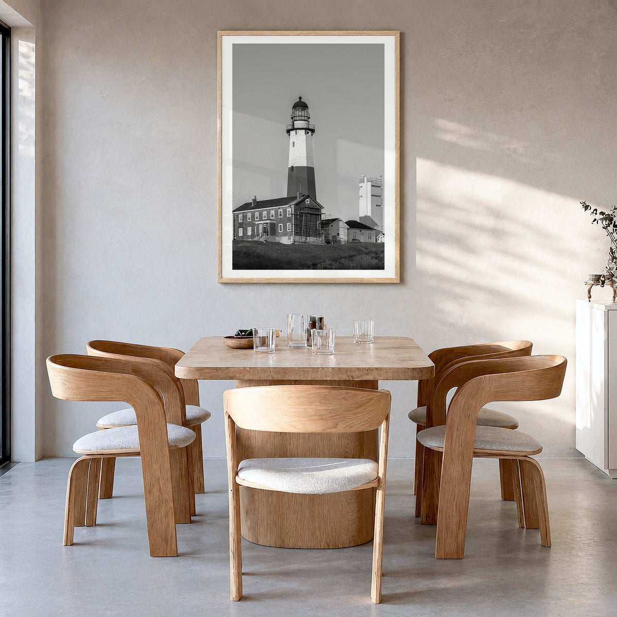 East Hampton Photo Poster in a natural wood frame, hanging in a dining room, white border