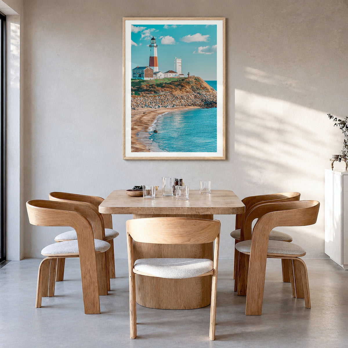 East Hampton Photo Poster in a natural wood frame, hanging in a dining room, white border