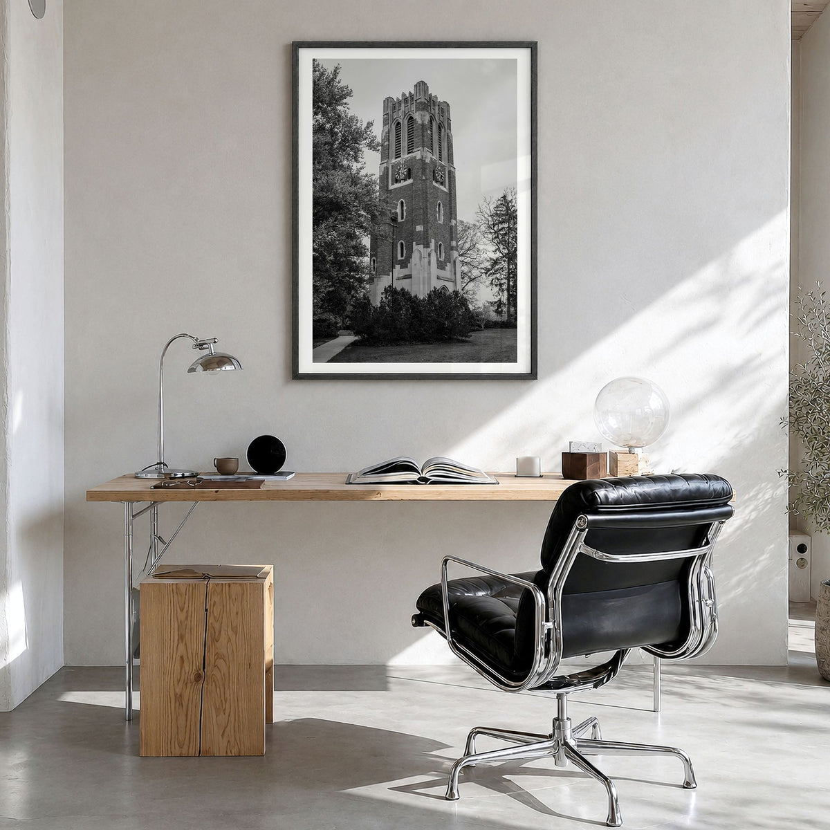 East Lansing Photo Poster in a black wood frame, hanging in a bright home office, white border