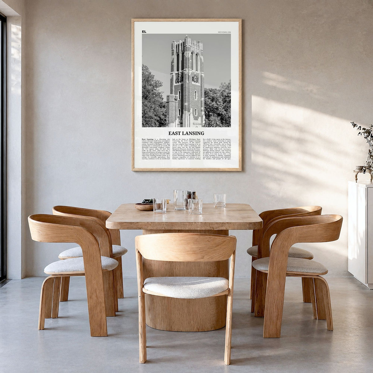 East Lansing Newspaper Poster in a natural wood frame, hanging in a dining room