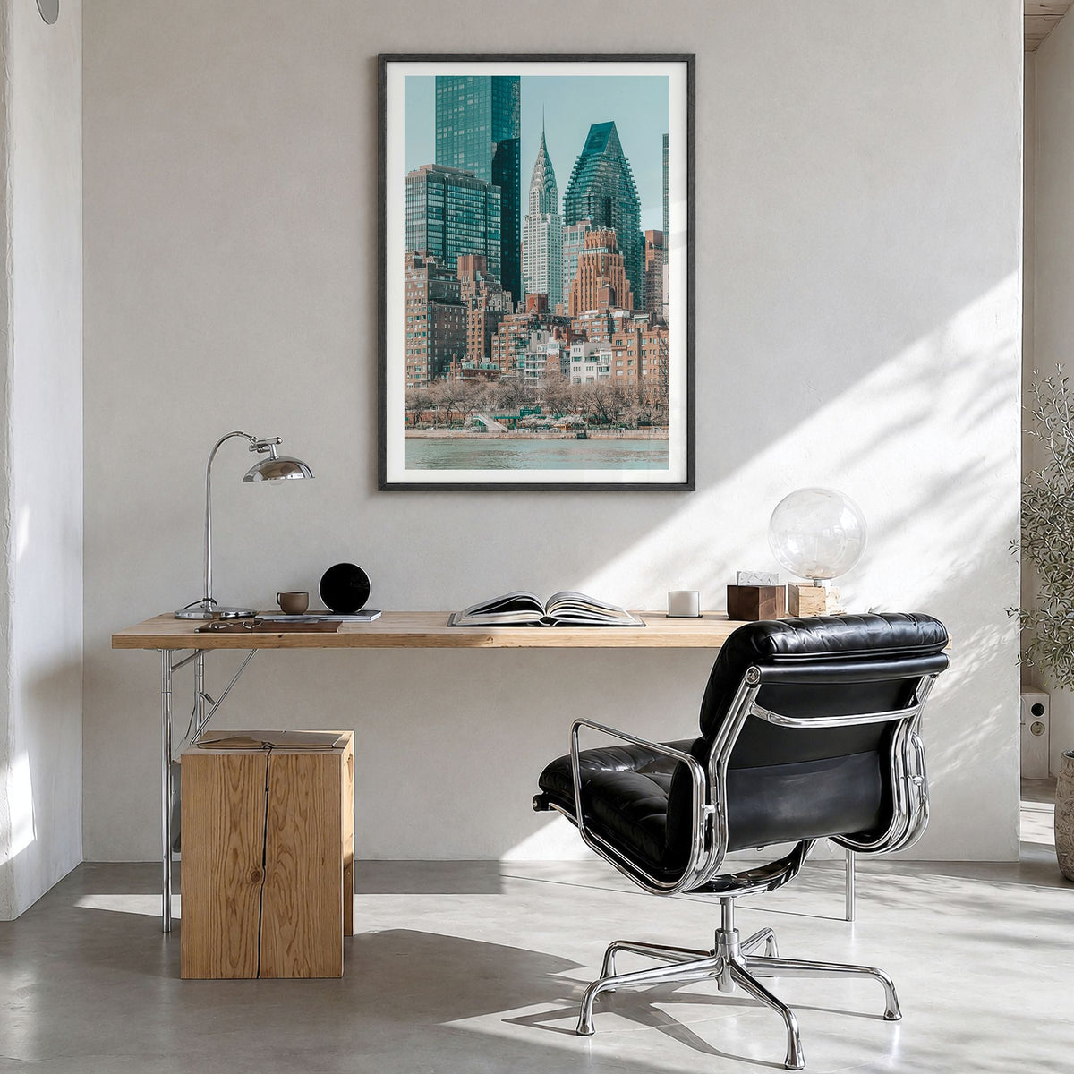 Roosevelt Island, New York City Photo Poster in a black wood frame, hanging in a bright home office, white border