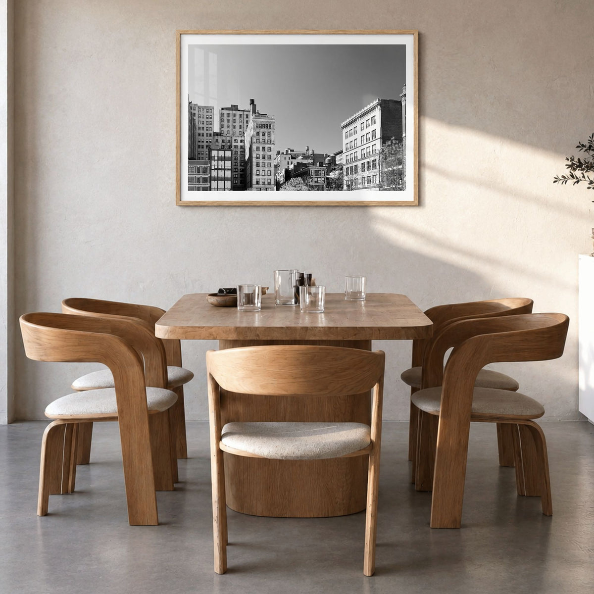 East Village, New York Photo Poster in a natural wood frame, hanging in a dining room, white border