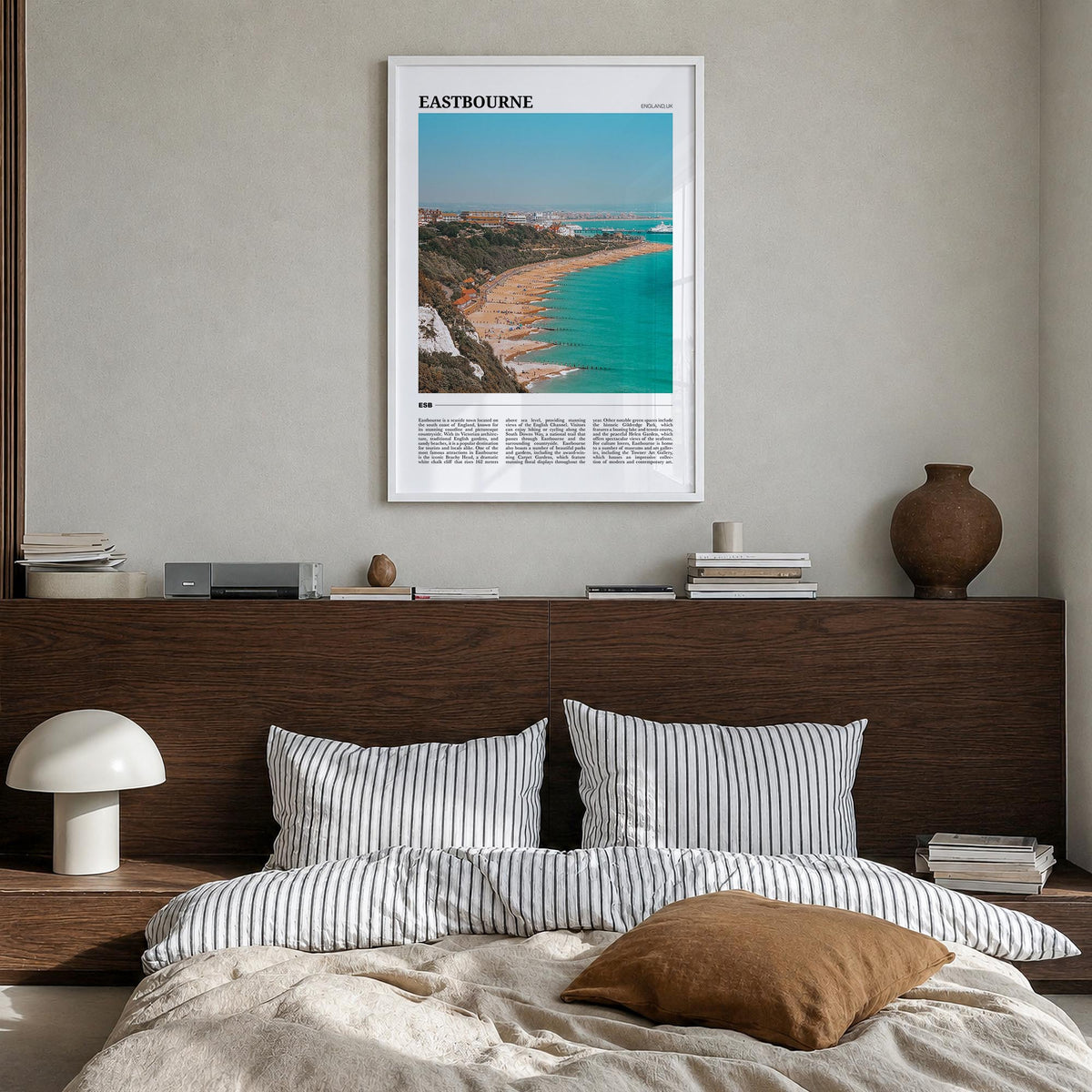 Eastbourne colorful travel poster of United Kingdom – vertical wall art in white wood frame, hanging on wall