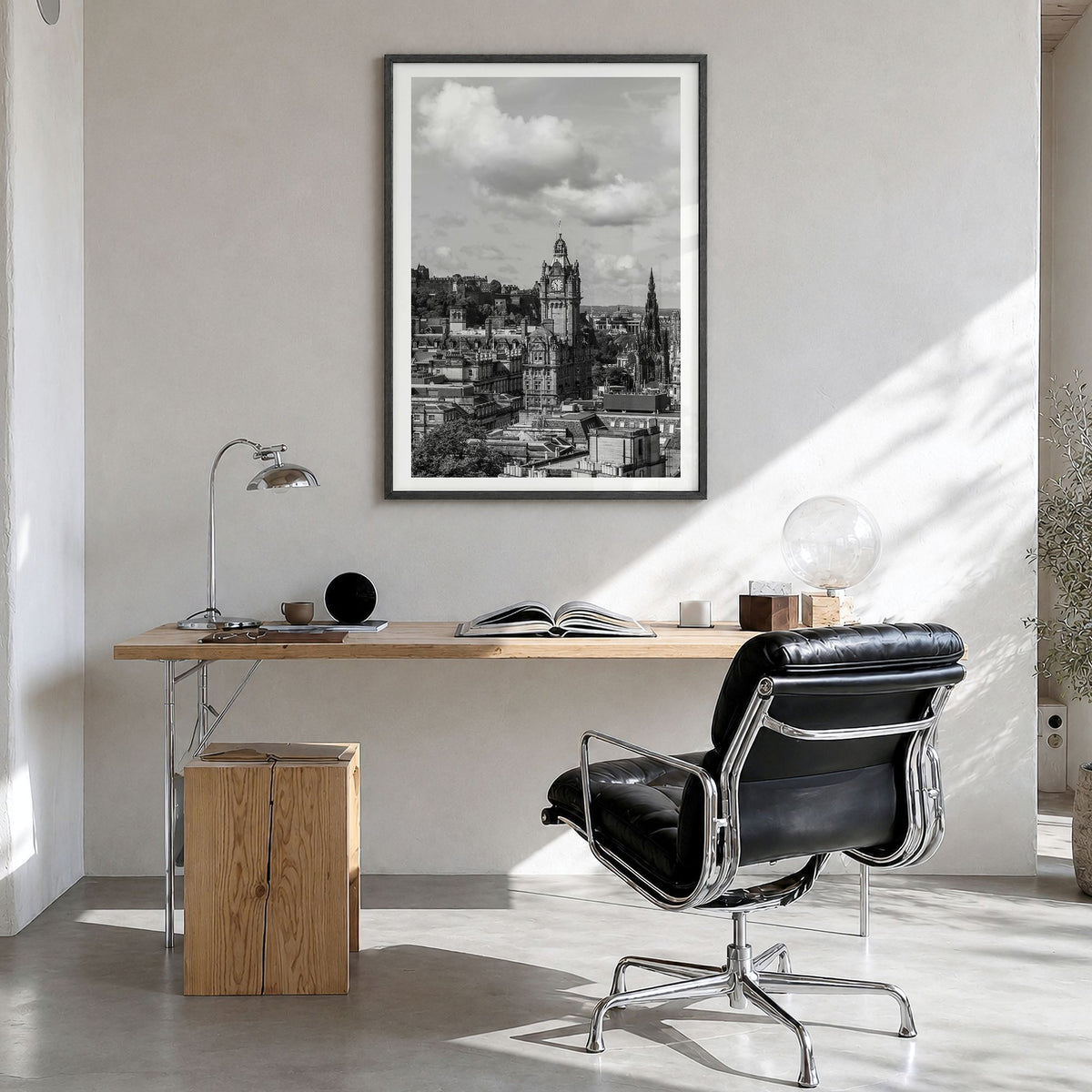 Edinburgh Photo Poster in a black wood frame, hanging in a bright home office, white border