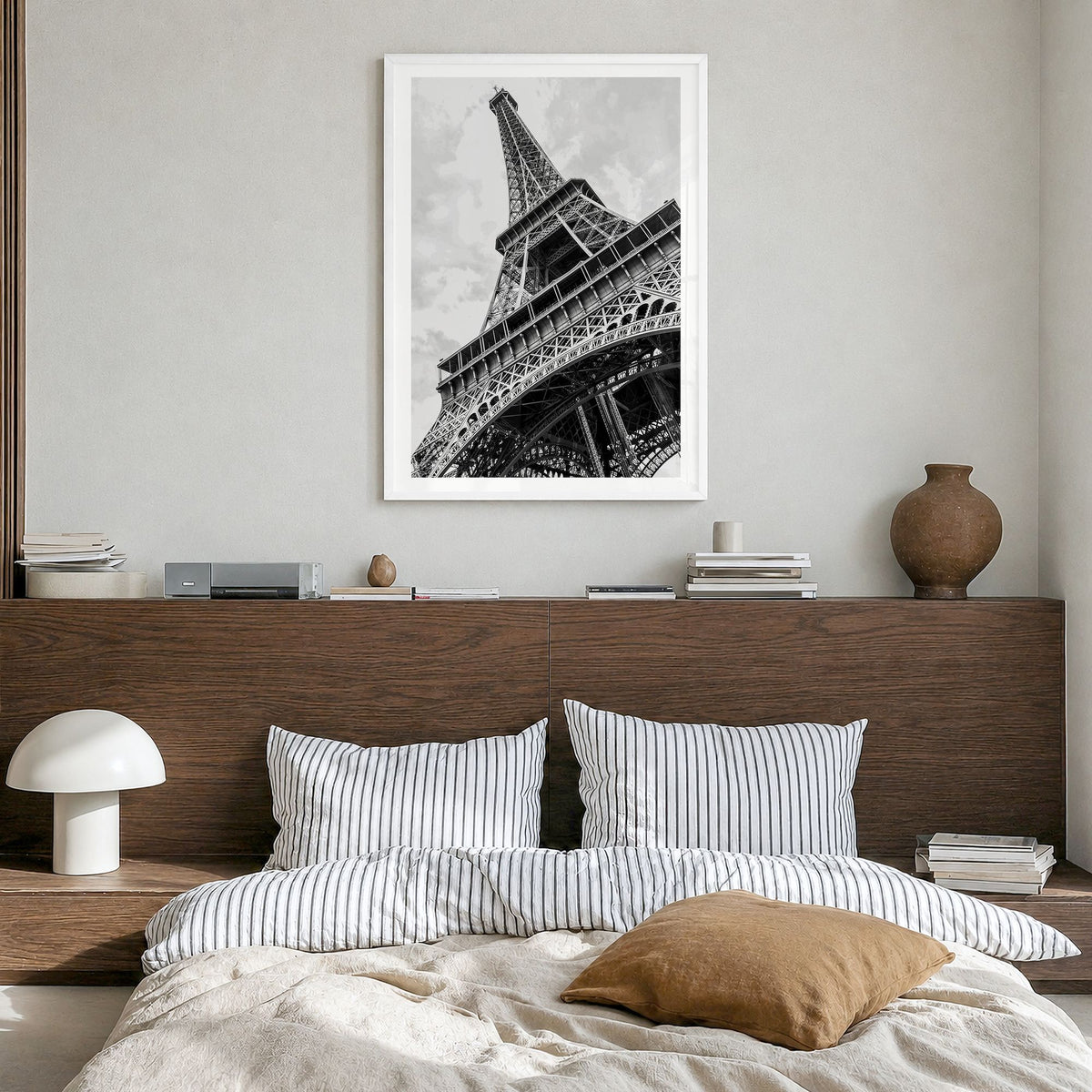 Eiffel Tower Photo Poster in a white wood frame, hanging in a bedroom, white border
