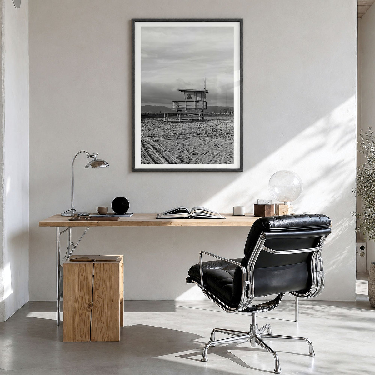 El Segundo Photo Poster in a black wood frame, hanging in a bright home office, white border