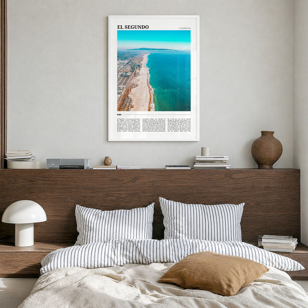 El Segundo Travel Poster in a white wood frame, hanging in a bedroom