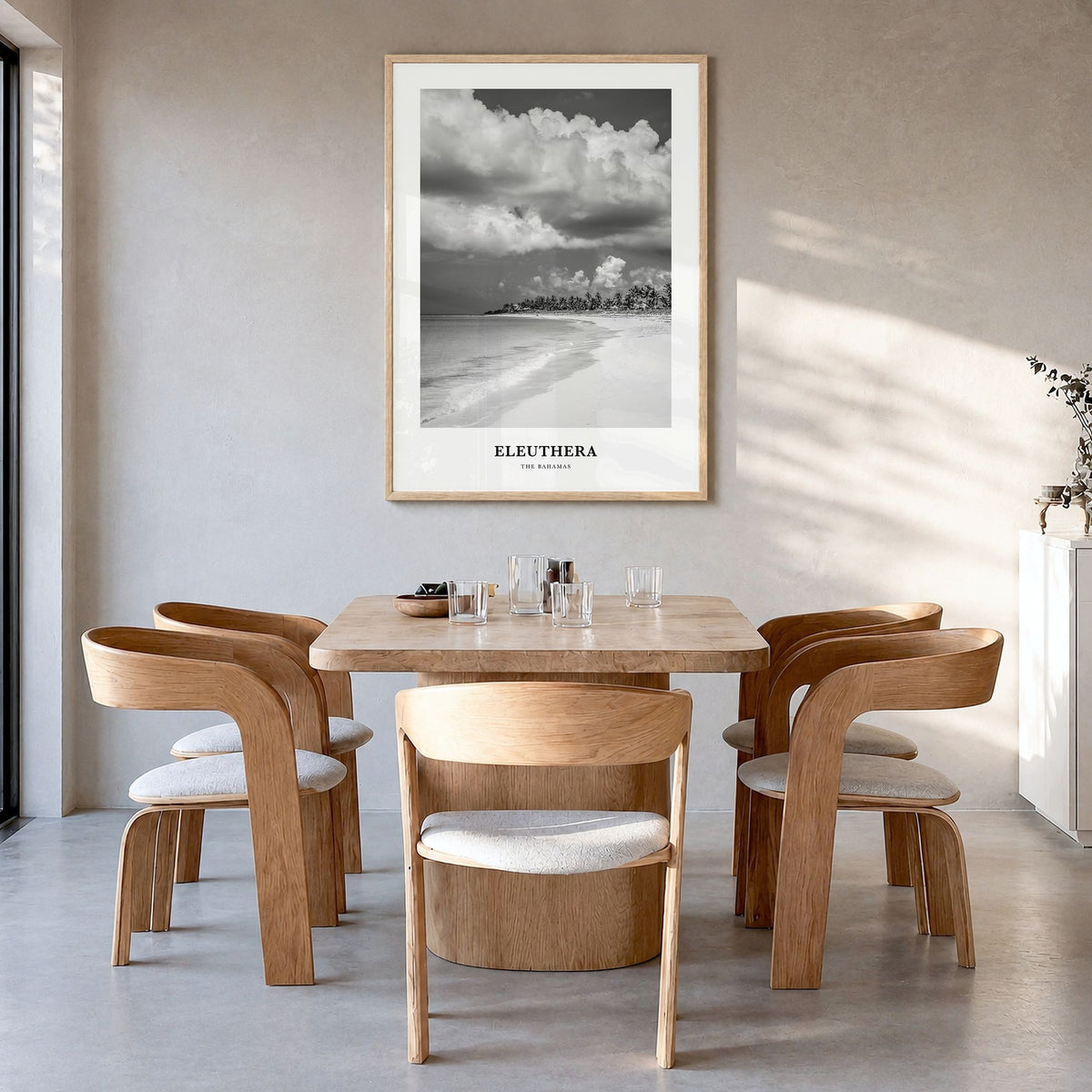 Eleuthera Classic Poster in a natural wood frame, hanging in a dining room