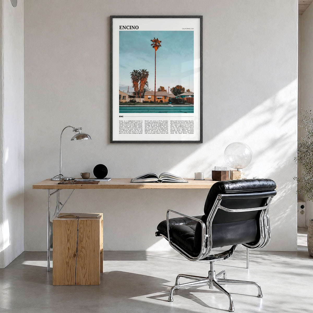 Encino Travel Poster in a black wood frame, hanging in a bright home office