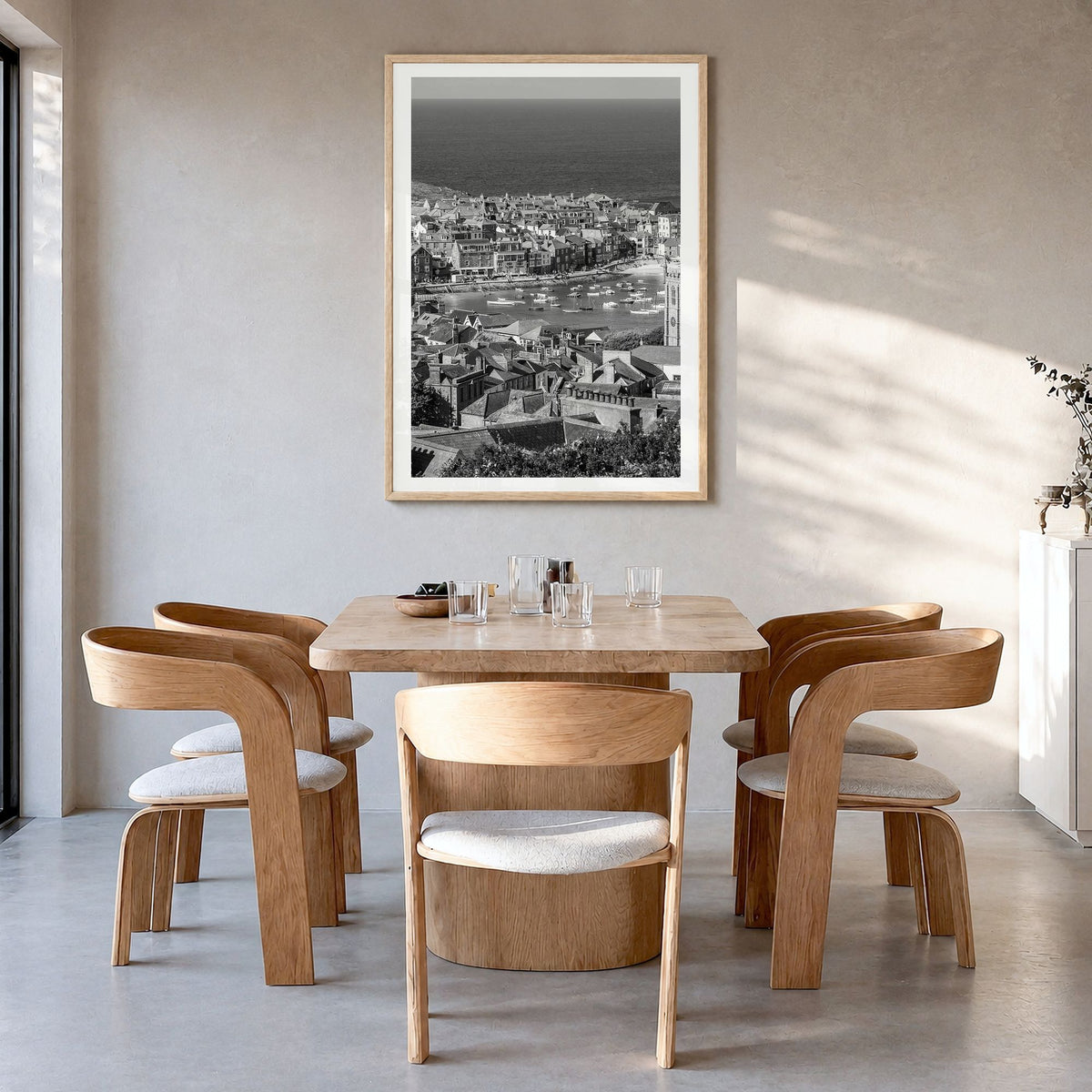 England Photo Poster in a natural wood frame, hanging in a dining room, white border