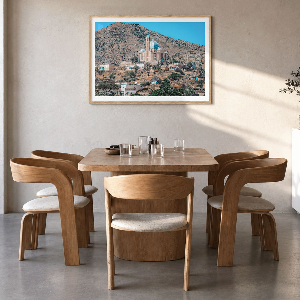 Eritrea Photo Poster in a natural wood frame, hanging in a dining room, white border