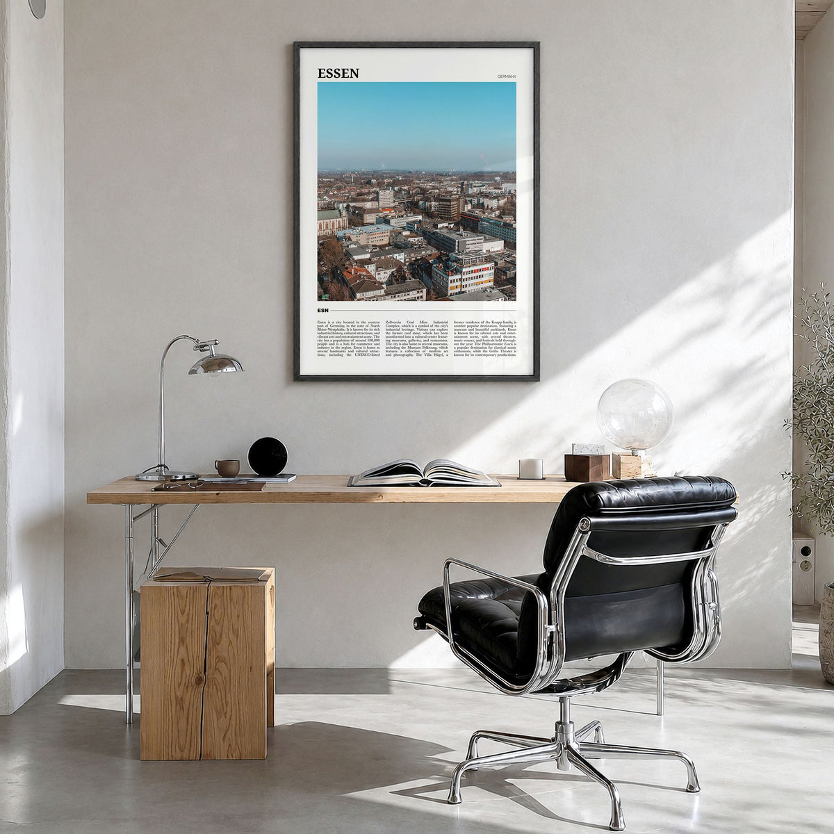 Essen Travel Poster in a black wood frame, hanging in a bright home office
