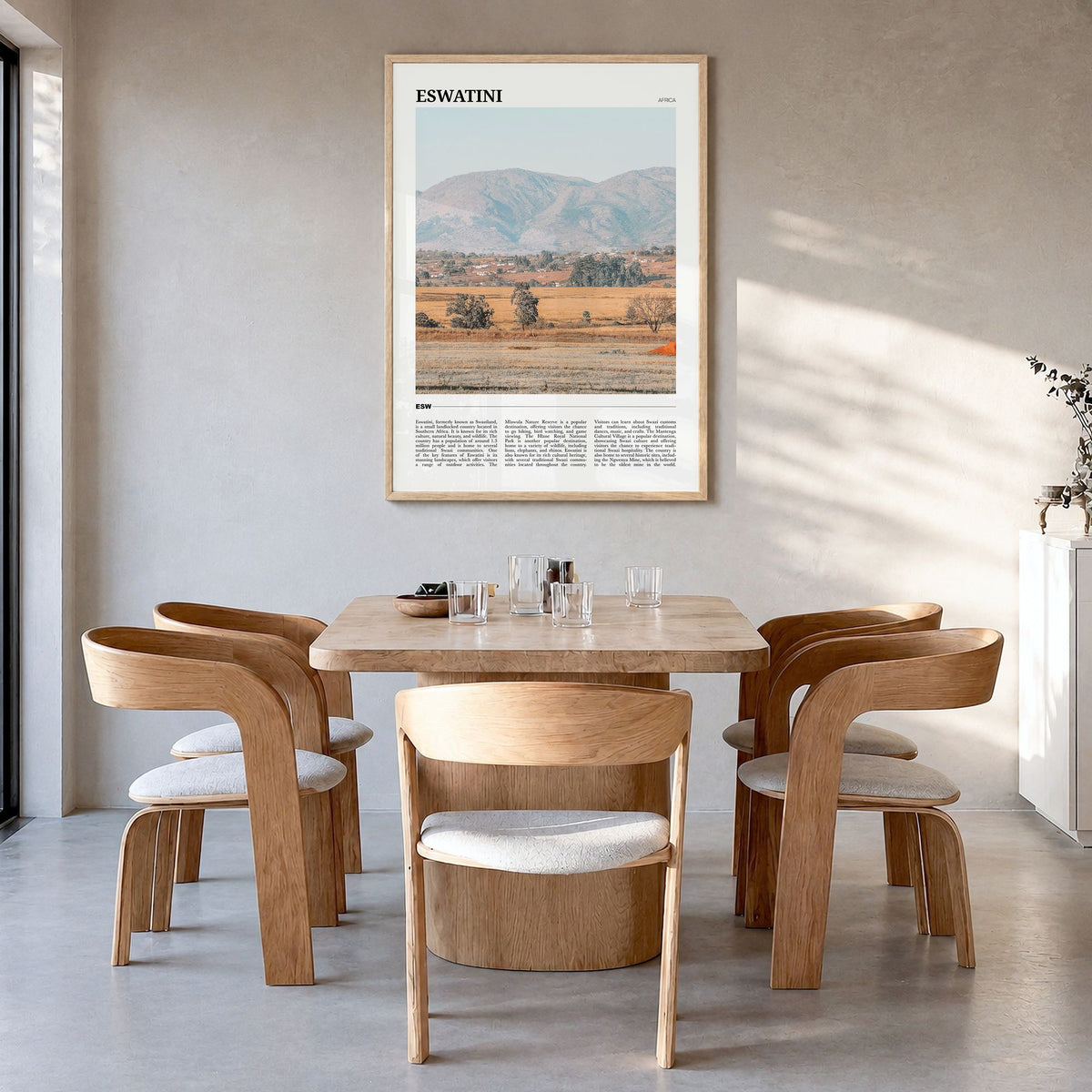 Eswatini Travel Poster in a natural wood frame, hanging in a dining room