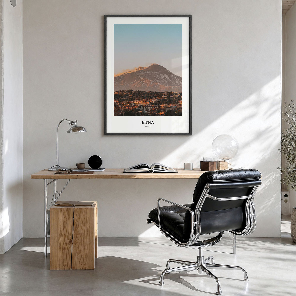 Etna Classic Poster in a black wood frame, hanging in a bright home office