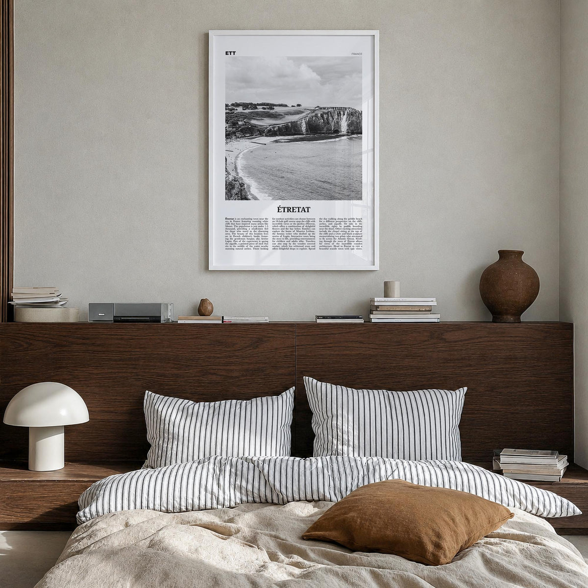 Étretat black & white newspaper poster of France – vertical wall art in white wood frame, hanging on wall