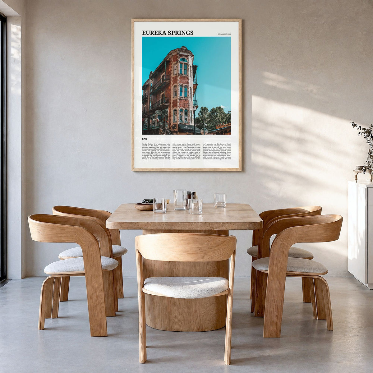 Eureka Springs Travel Poster in a natural wood frame, hanging in a dining room