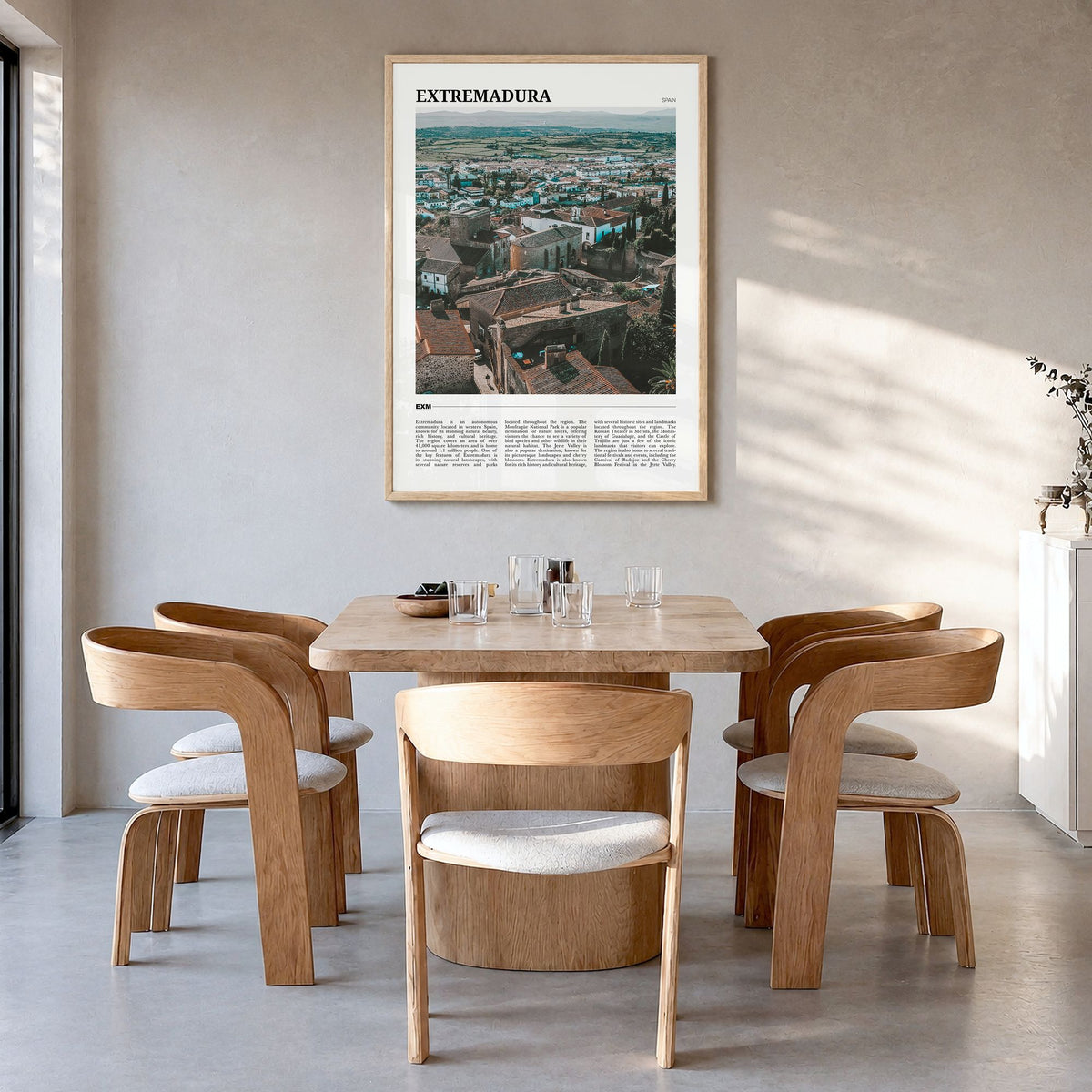 Extremadura Travel Poster in a natural wood frame, hanging in a dining room