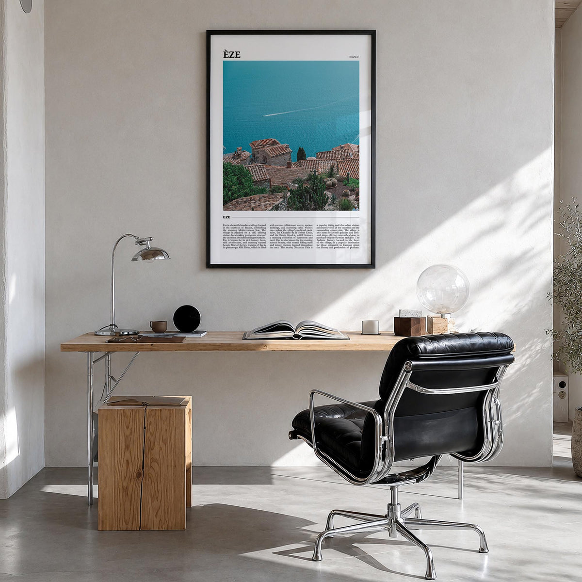 Èze colorful travel poster of France – vertical wall art in black wood frame, hanging on wall