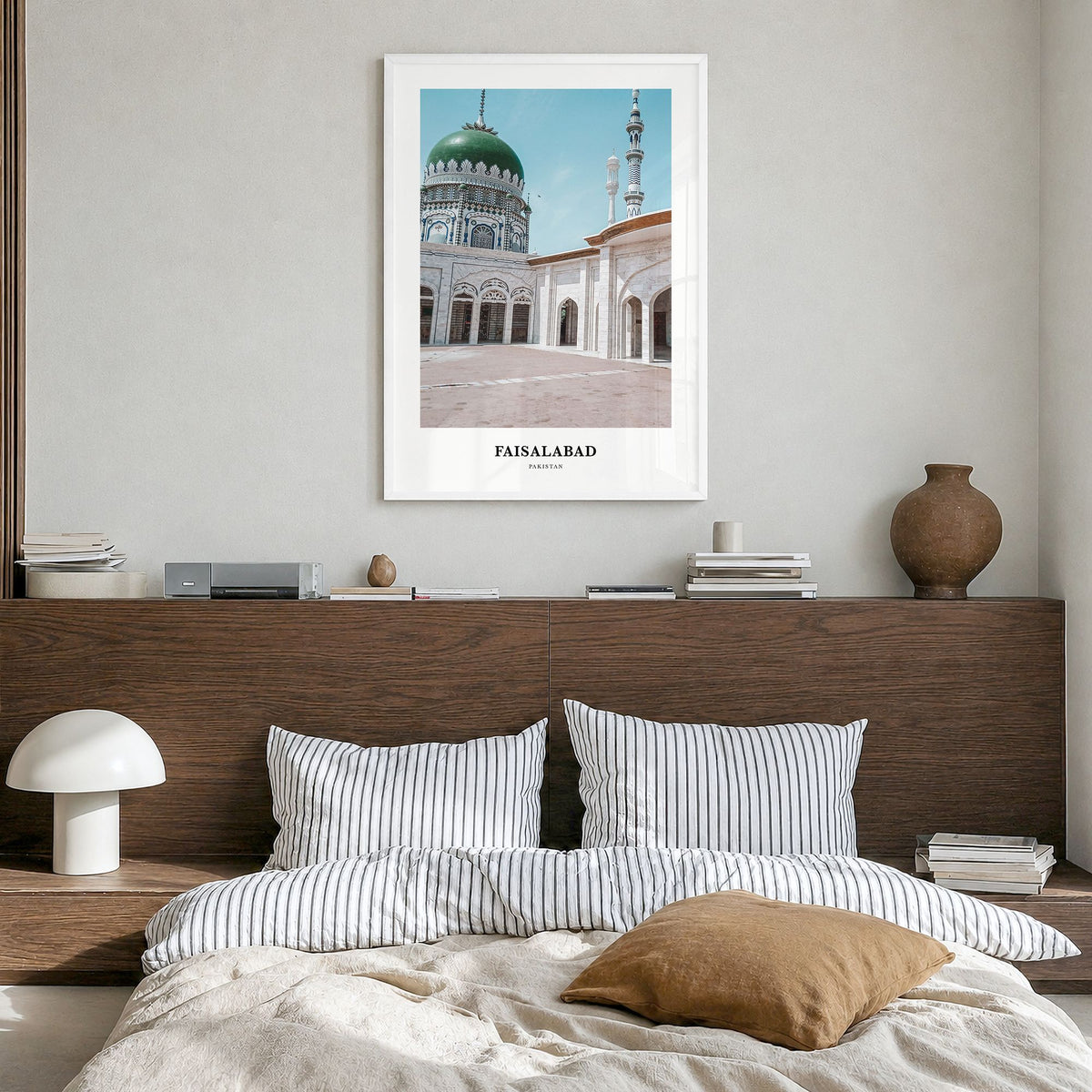 Faisalabad Classic Poster in a white wood frame, hanging in a bedroom