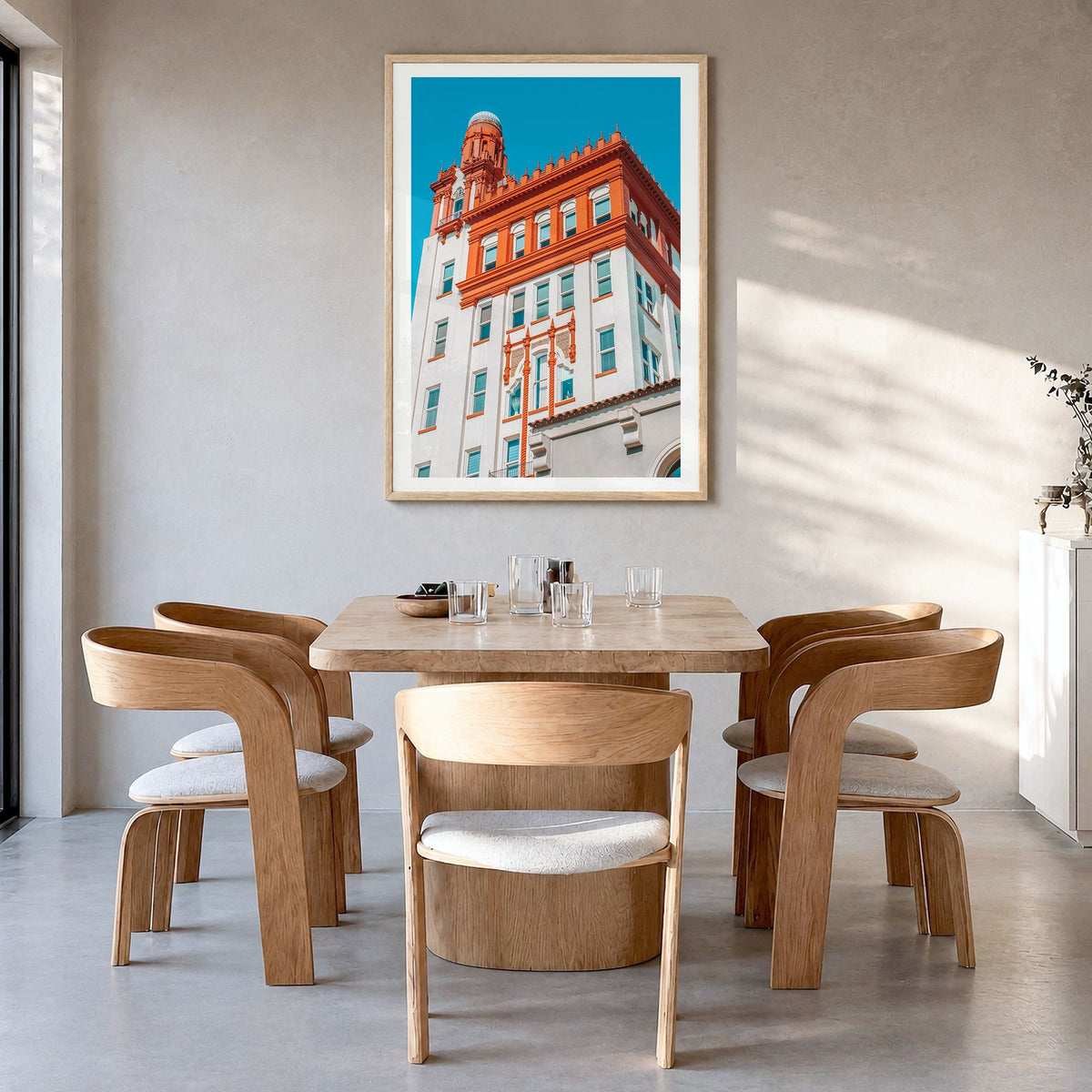 Fargo Photo Poster in a natural wood frame, hanging in a dining room, white border