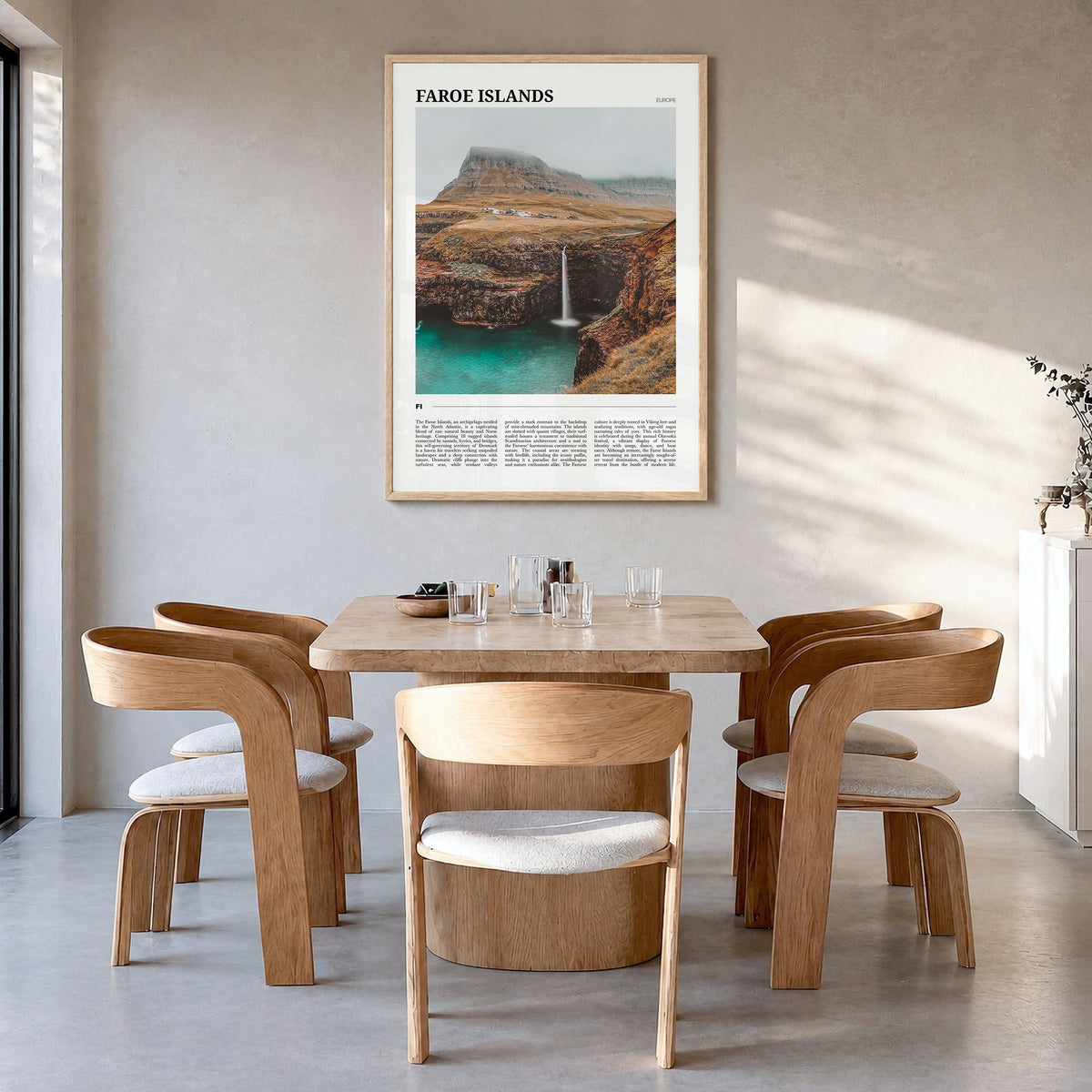 Faroe Islands Travel Poster in a natural wood frame, hanging in a dining room