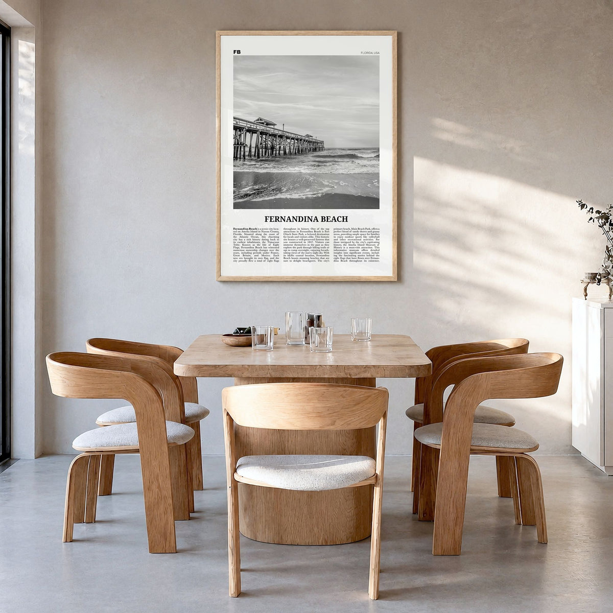 Fernandina Beach Newspaper Poster in a natural wood frame, hanging in a dining room