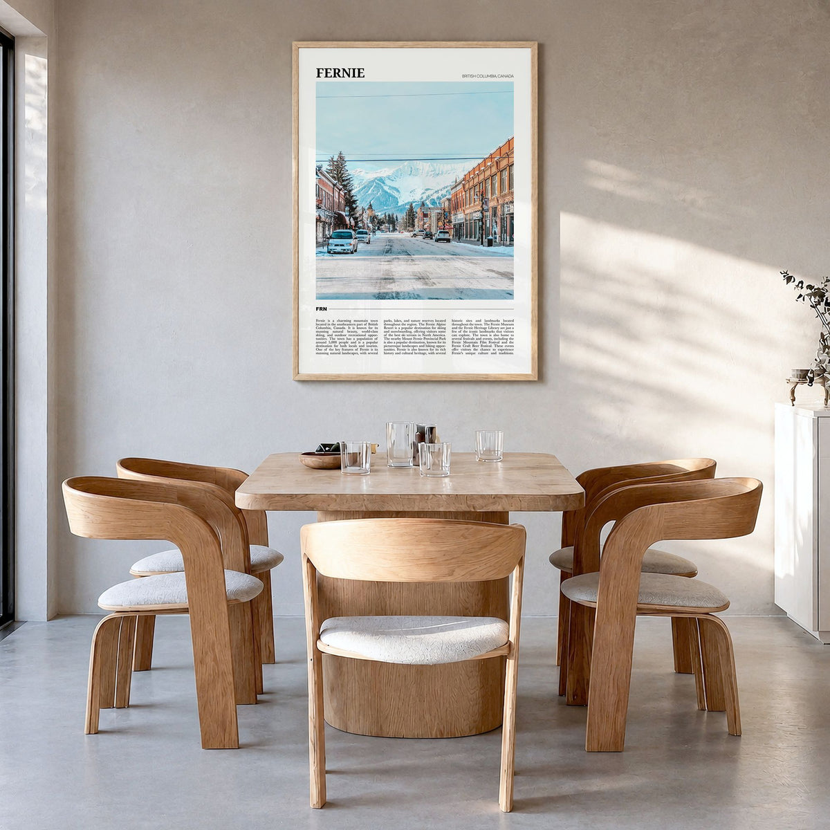 Fernie Travel Poster in a natural wood frame, hanging in a dining room