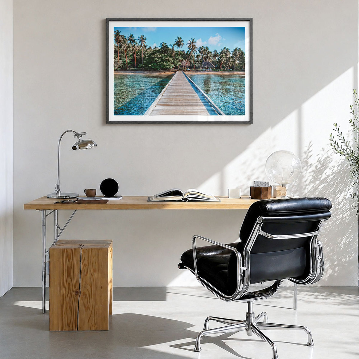 Fiji Photo Poster in a black wood frame, hanging in a bright home office, white border