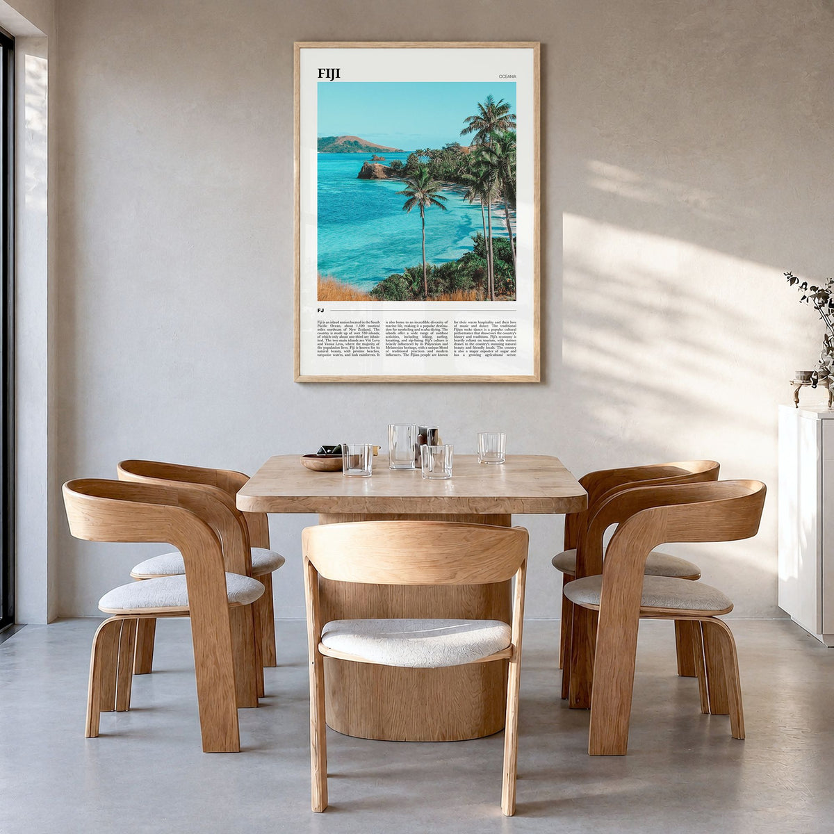 Fiji Travel Poster in a natural wood frame, hanging in a dining room