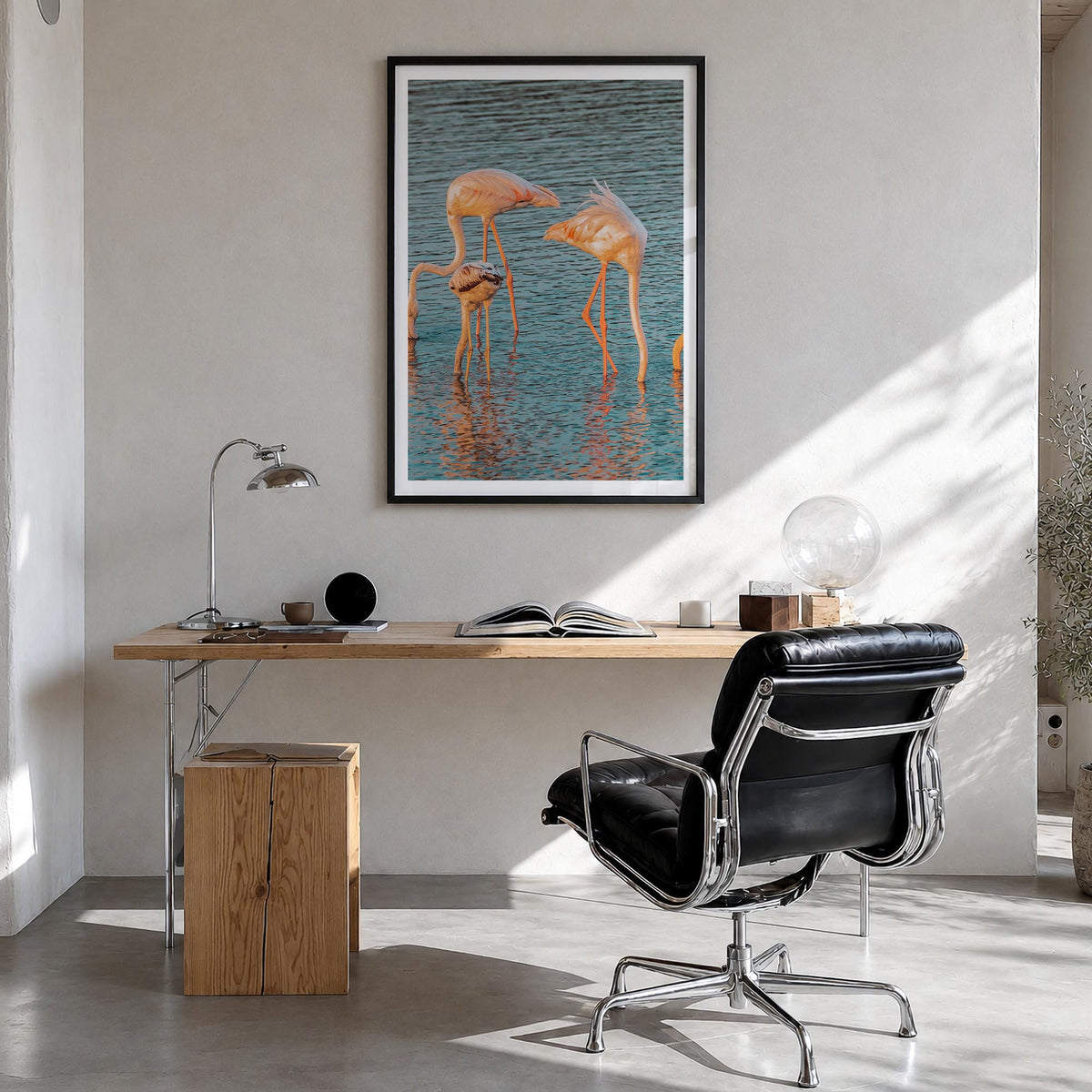 Flamingo no. 1 colorful photo poster – vertical wall art in black wood frame with white border, hanging on wall