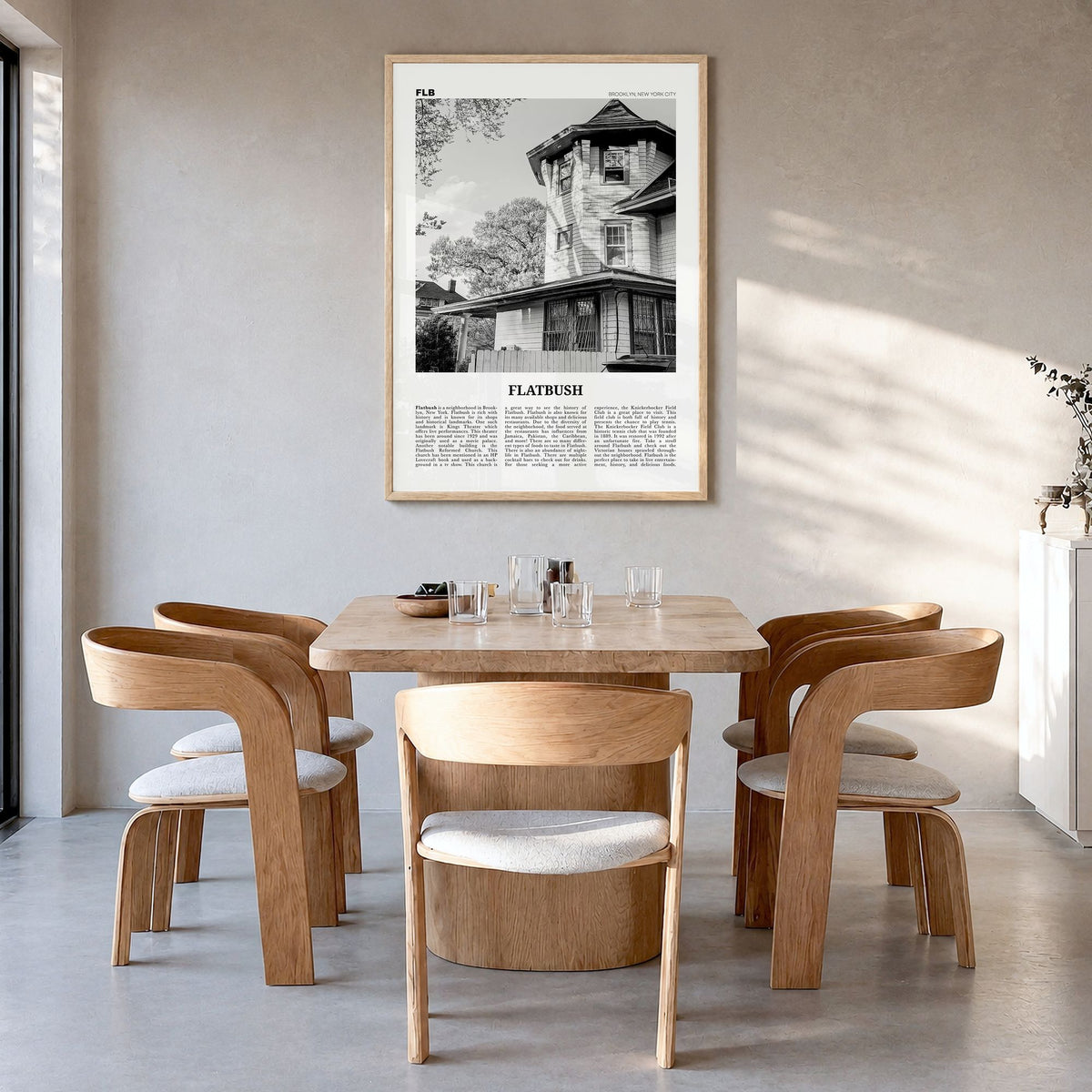 Flatbush Newspaper Poster in a natural wood frame, hanging in a dining room