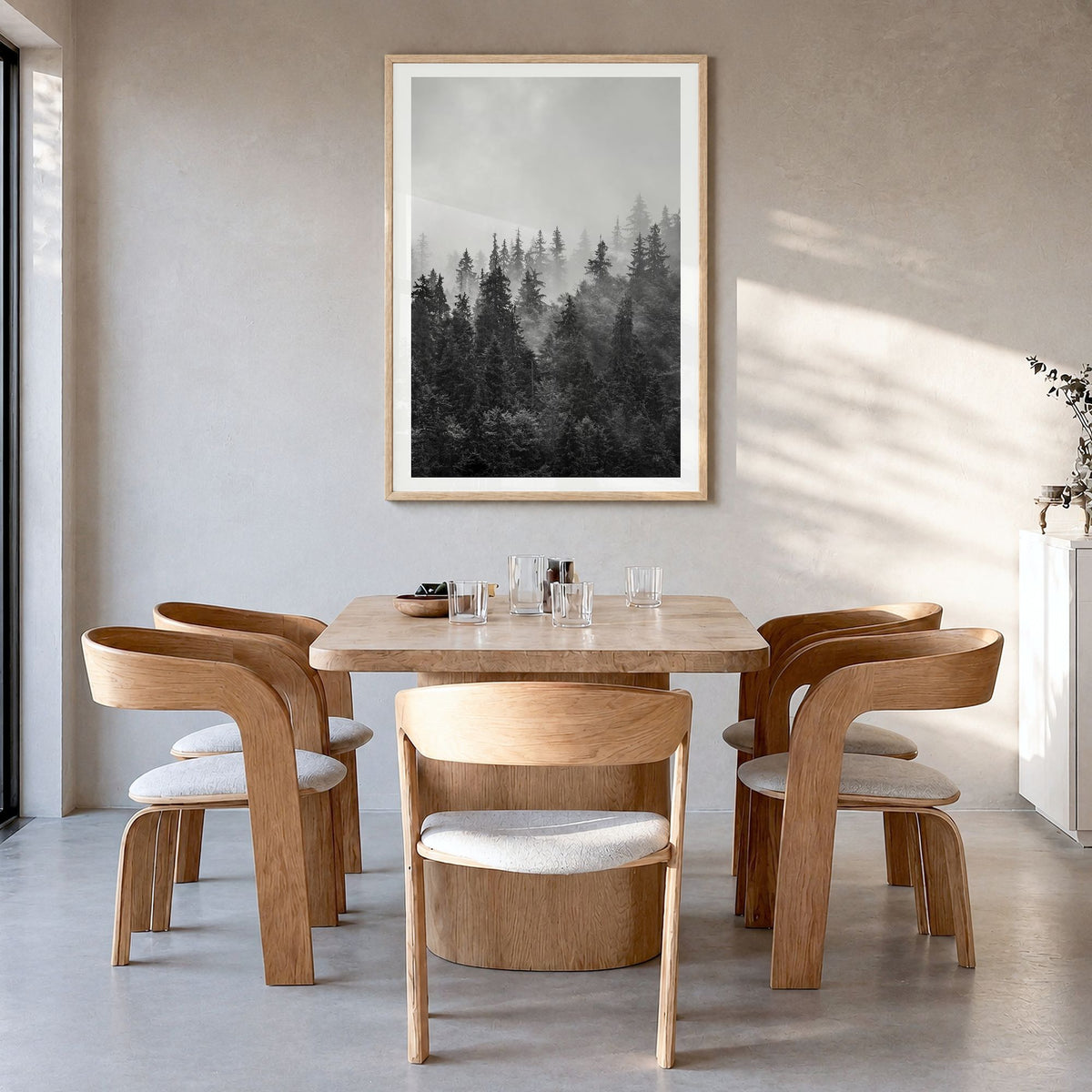 Foggy Forest Photo No 1 Poster in a natural wood frame, hanging in a dining room, white border