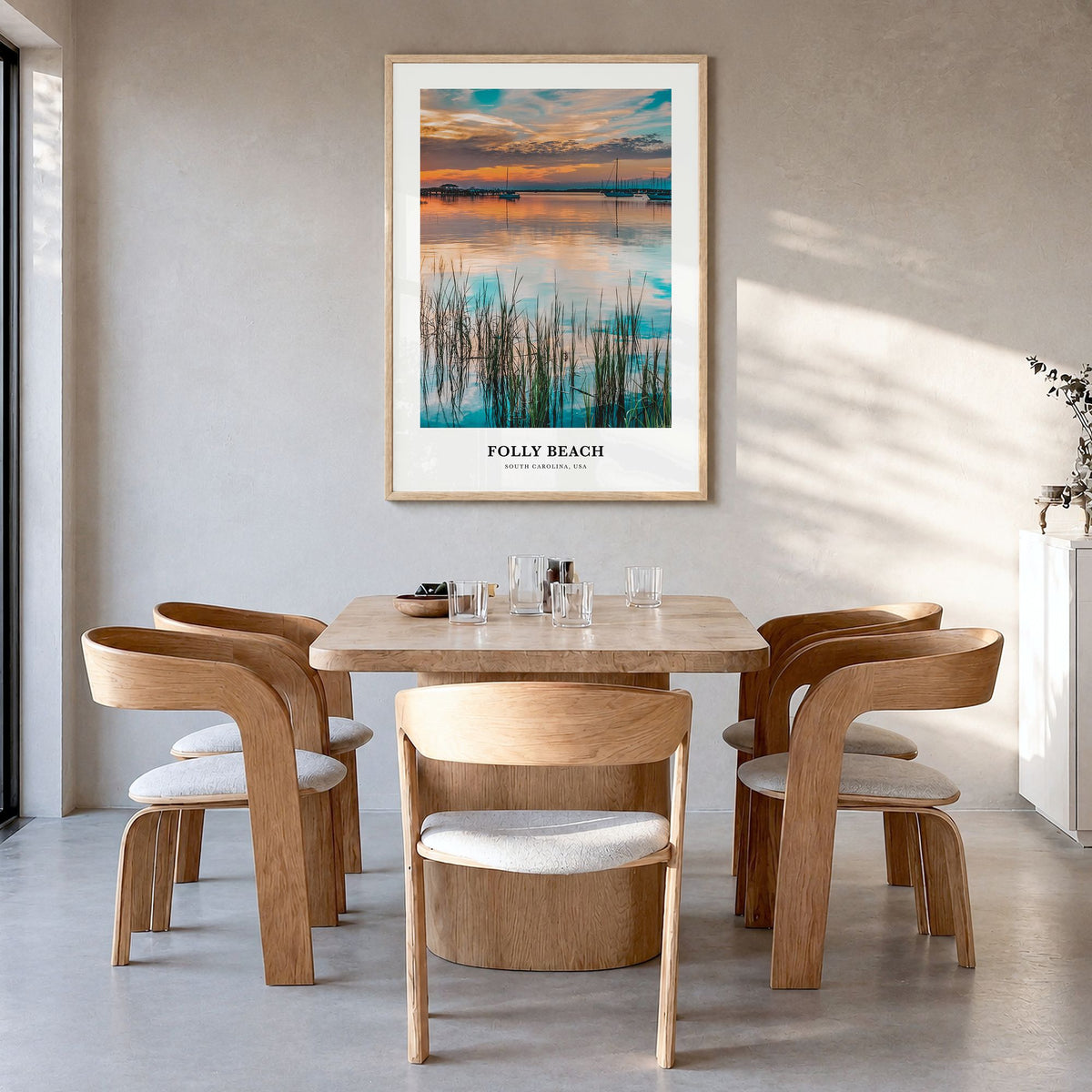 Folly Beach Classic Poster in a natural wood frame, hanging in a dining room